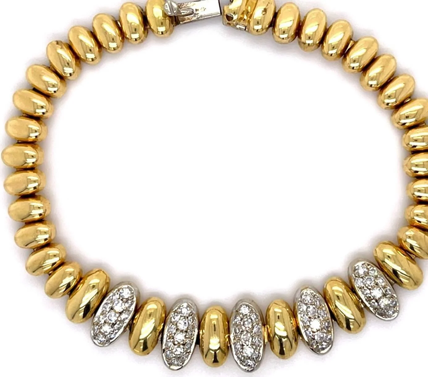 From Fall 2025&rsquo;s estate jewelry selections, this distinctive Retro-era,18-karat yellow and white gold bracelet set with diamonds. #estatejewelry #retrobracelet #vintagebracelet