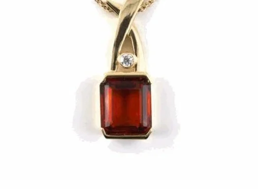 14-karat yellow gold Italian pendant mounted with a very fine citrine quartz weighing about 8.00 carats, with a diamond weighing about 0.12 carat