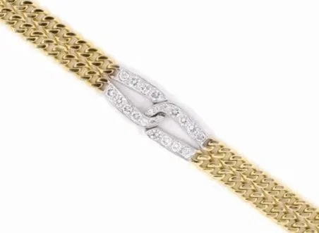 A boldly simple 18-karat yellow gold bracelet, the white gold center "love knot" paved with diamonds weighing about 2.10 carats total.
