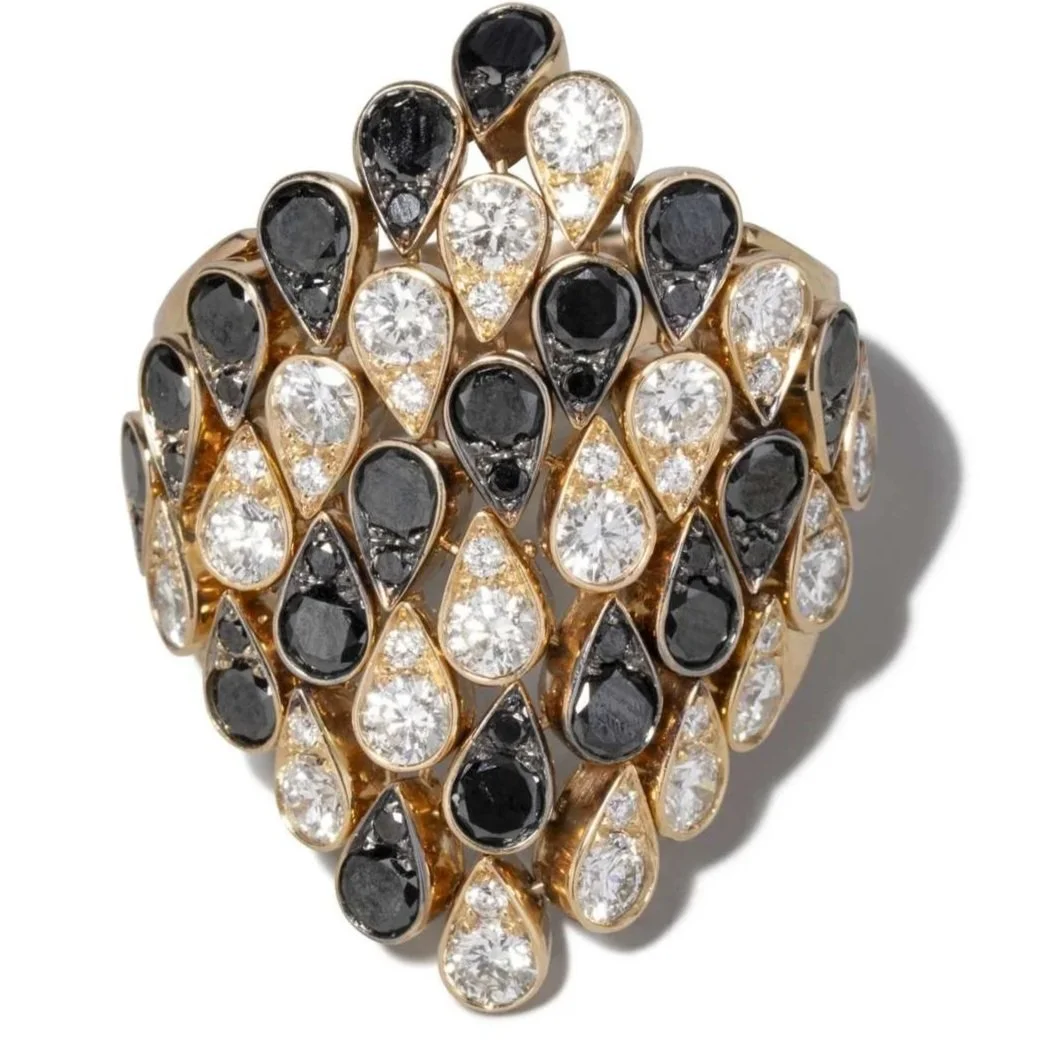 Very large Italian 18k rose gold ring mounted with black and white diamonds.