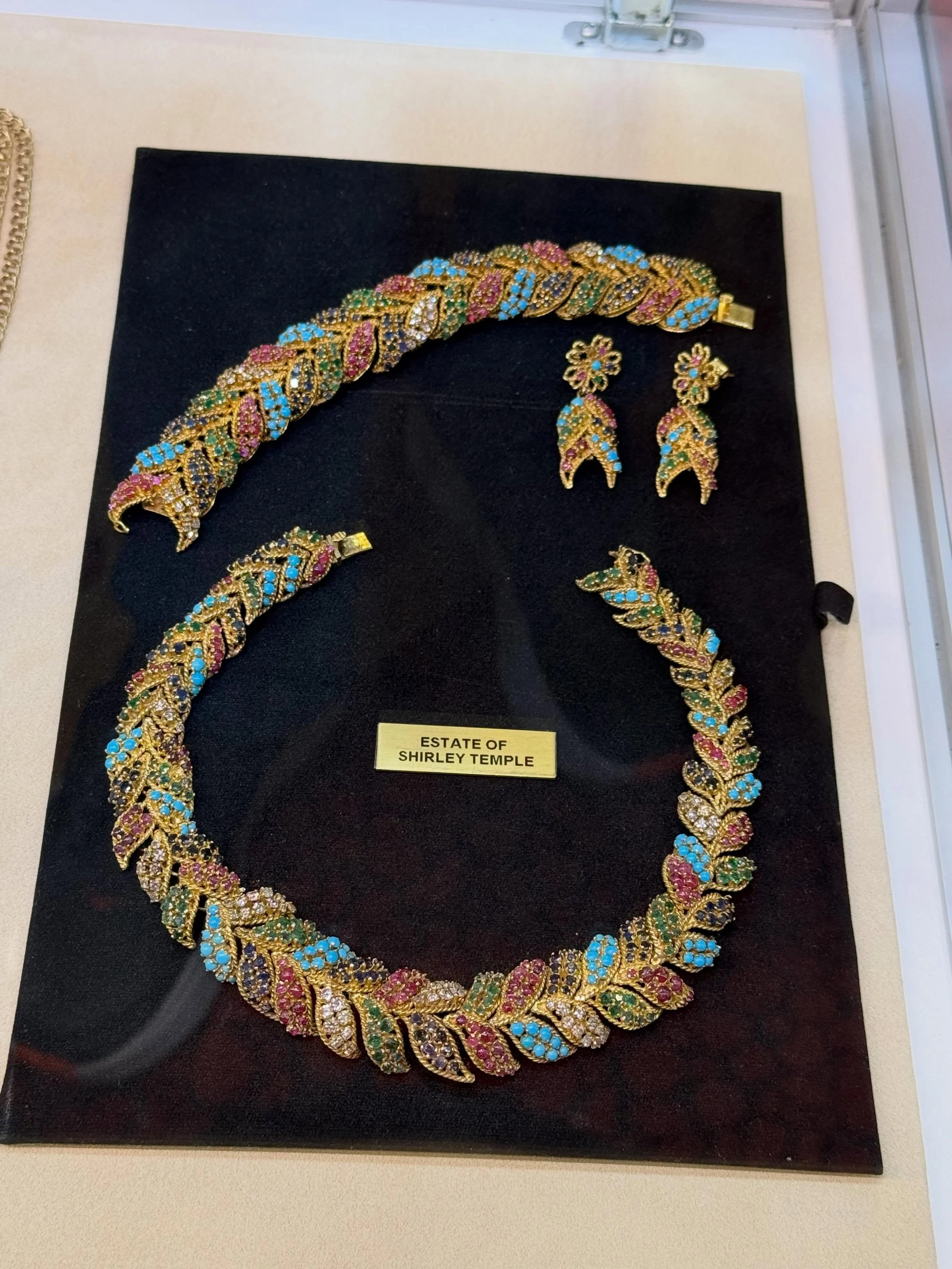 From the Estate of Shirley Temple

One of my favorite discoveries from the Las Vegas Antique Jewelry &amp; Watch Show last week.

This colorful gemstone demi-parure&mdash;necklace, bracelet, and earrings&mdash;comes from the estate of Shirley Temple,