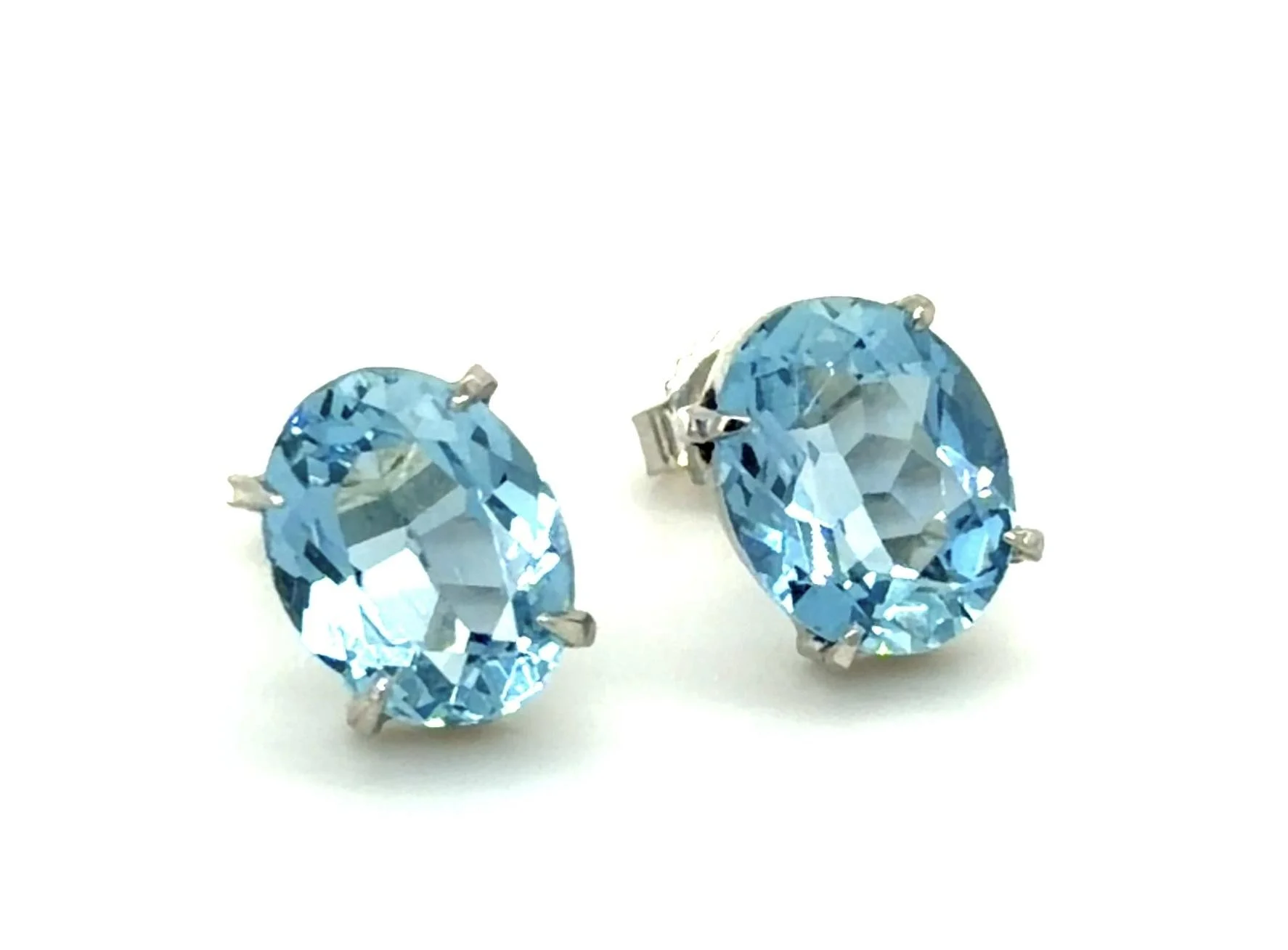 This picture does not do justice to the color of these fine quality aquamarine stud earrings, set in 14-karat white gold.