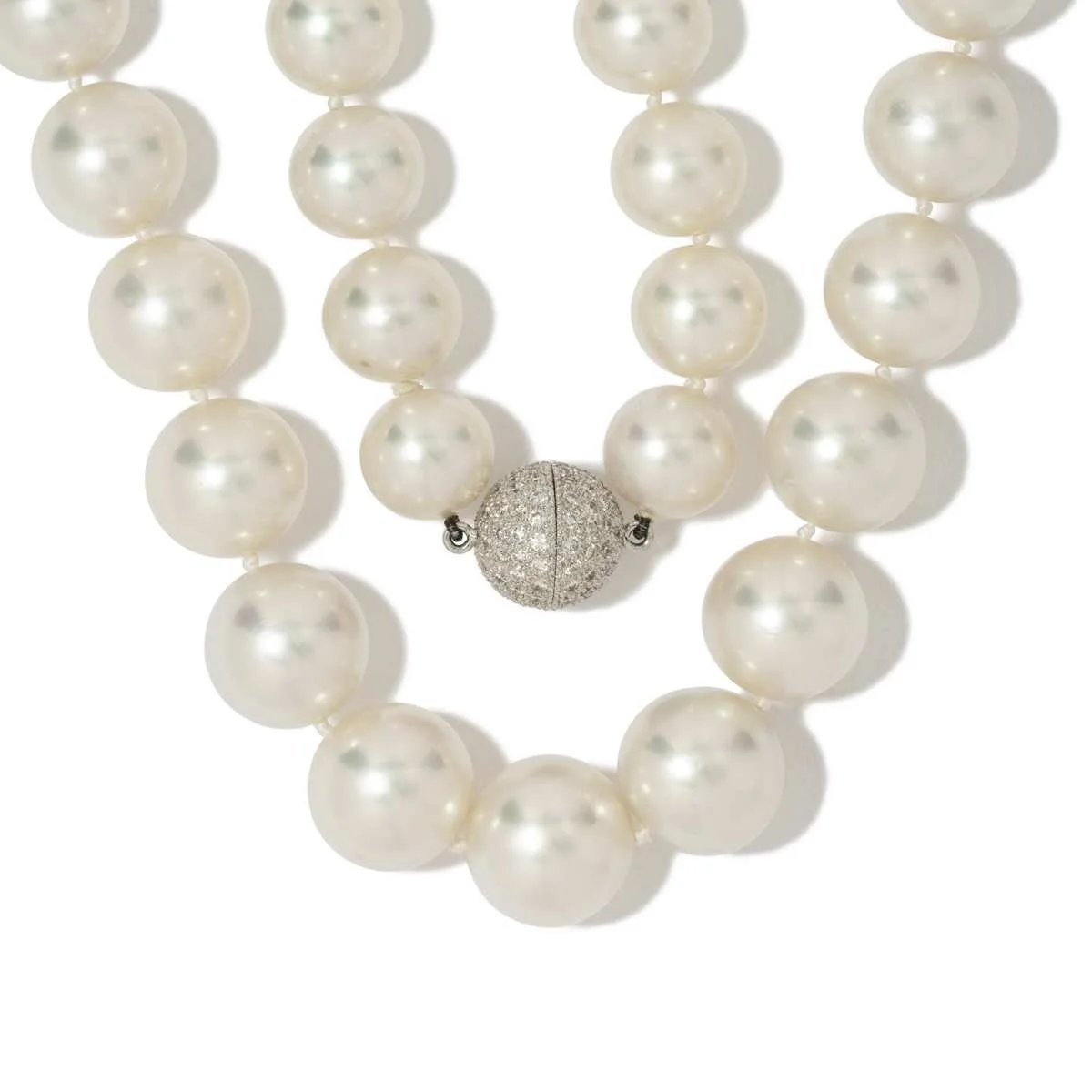 
A quietly impressive necklace with South Seas pearls graduating from 14-11.2 mm, with 18k white gold diamond ball clasp.