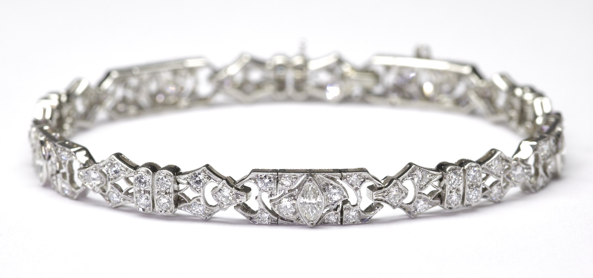 This classic Art Deco bracelet measures 1/4" wide and is mounted with 95 diamonds weighing about 2.65 carats total. Wear it any time, day or night.