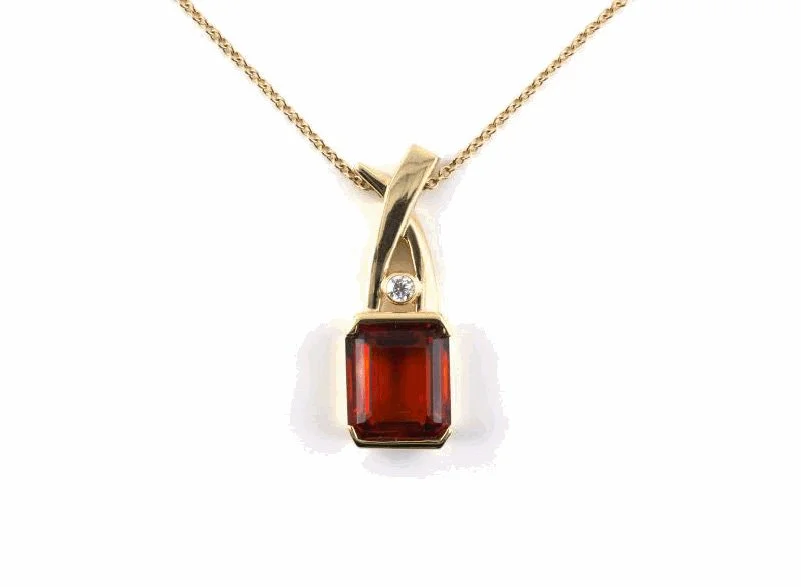 14-karat yellow gold Italian pendant mounted with a very fine citrine quartz weighing about 8.00 carats, with a diamond weighing about 0.12 carat