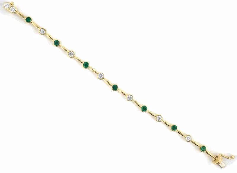 A stylish 18-karat yellow gold straightline bracelet alternating eight round diamonds with seven fine round emeralds.