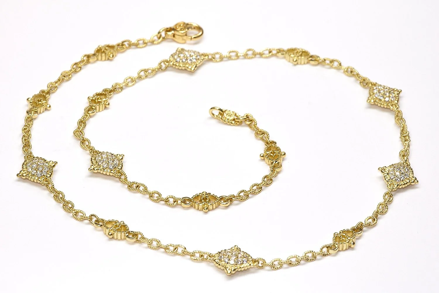 By Judith Ripka, in luxurious textured 18-karat gold, this 18"-necklace features two-sided diamond-set stations, about 2.50 carats total.