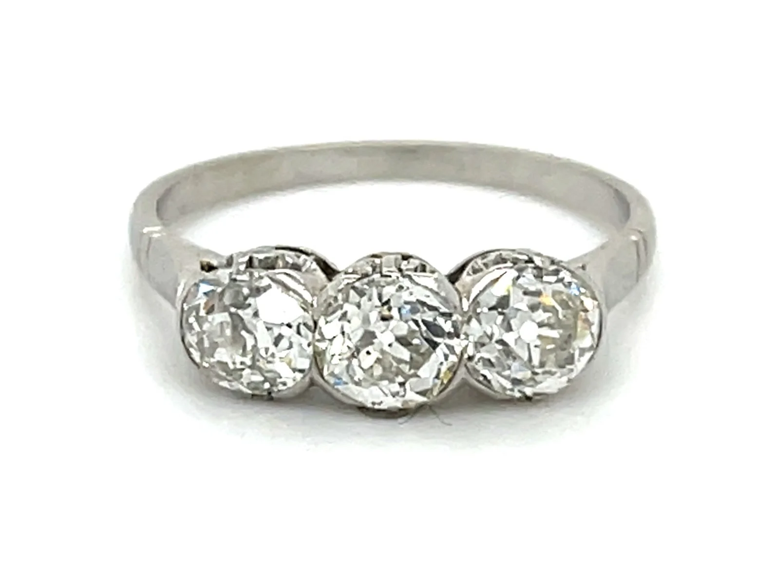 Art Deco simplicity in platinum, withy three old cut diamonds weighing about 1.75 carats total.
