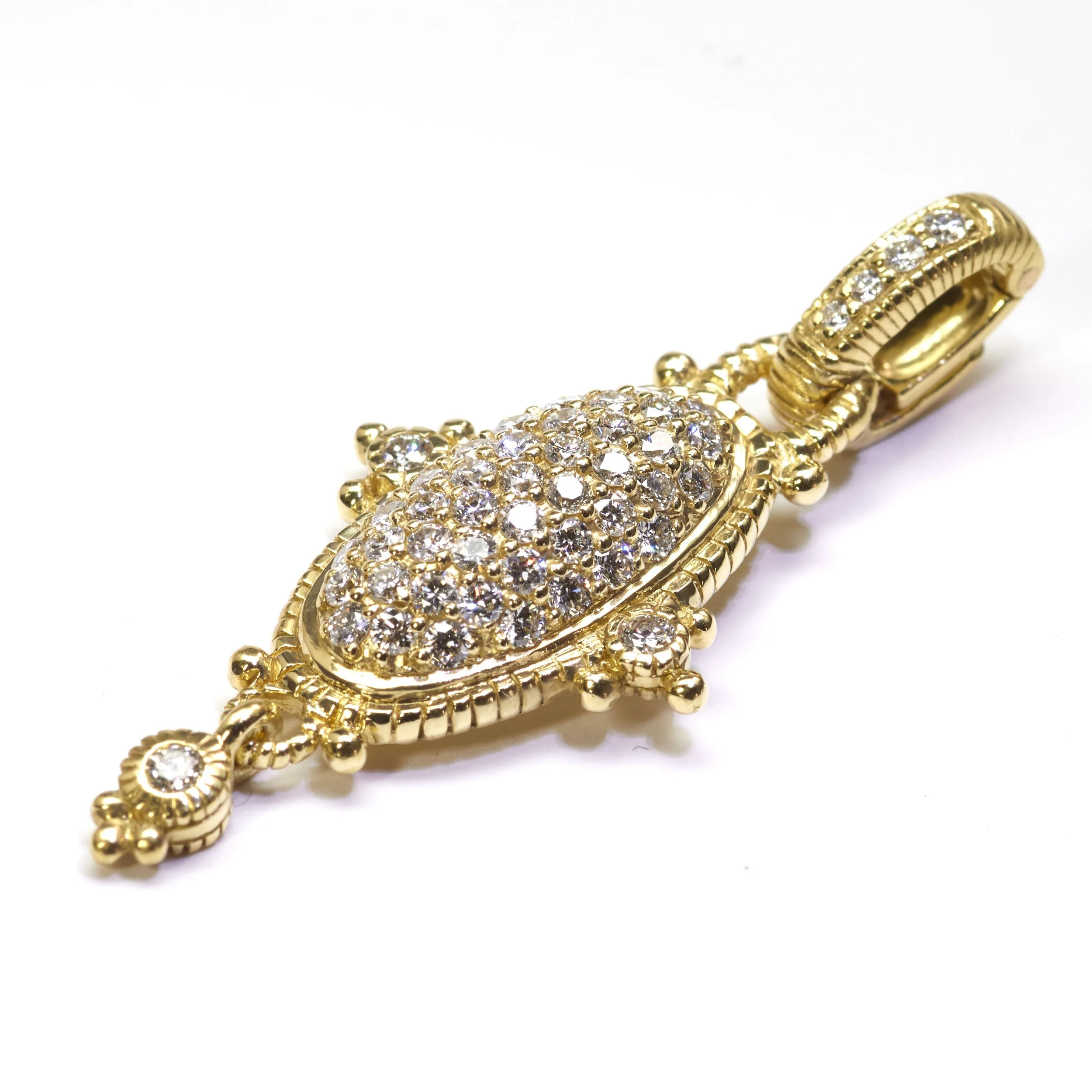 This pendant by Judith Ripka in rich 18-karat yellow gold has a bail that hinges open, allowing it to be worn on various chains. It  is mounted with 54 diamonds weighing about 1.11 carats total. Measures 2" top to bottom.