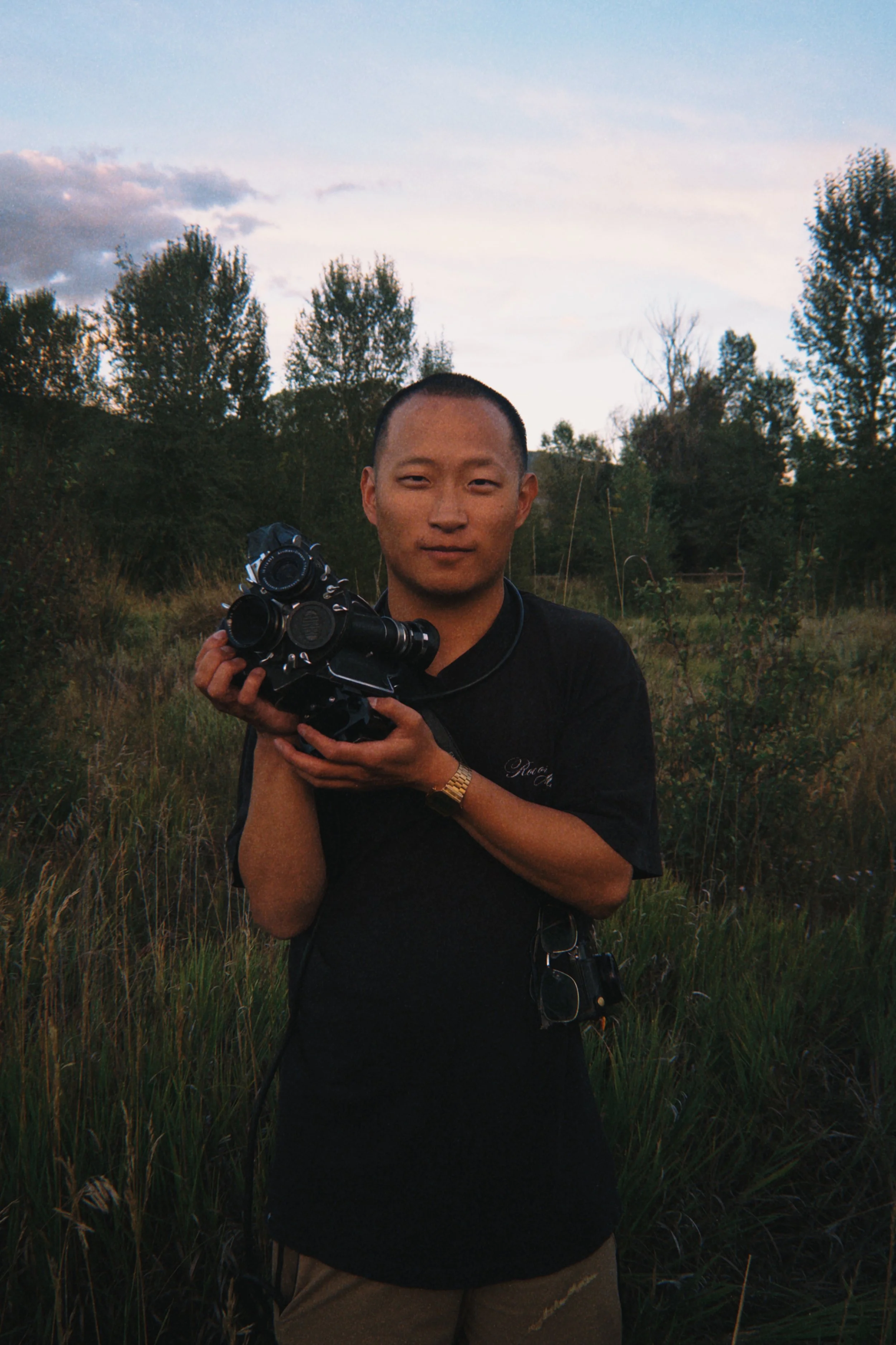 Jonathan Nelson's headshot while holding an Arriflex 16S
