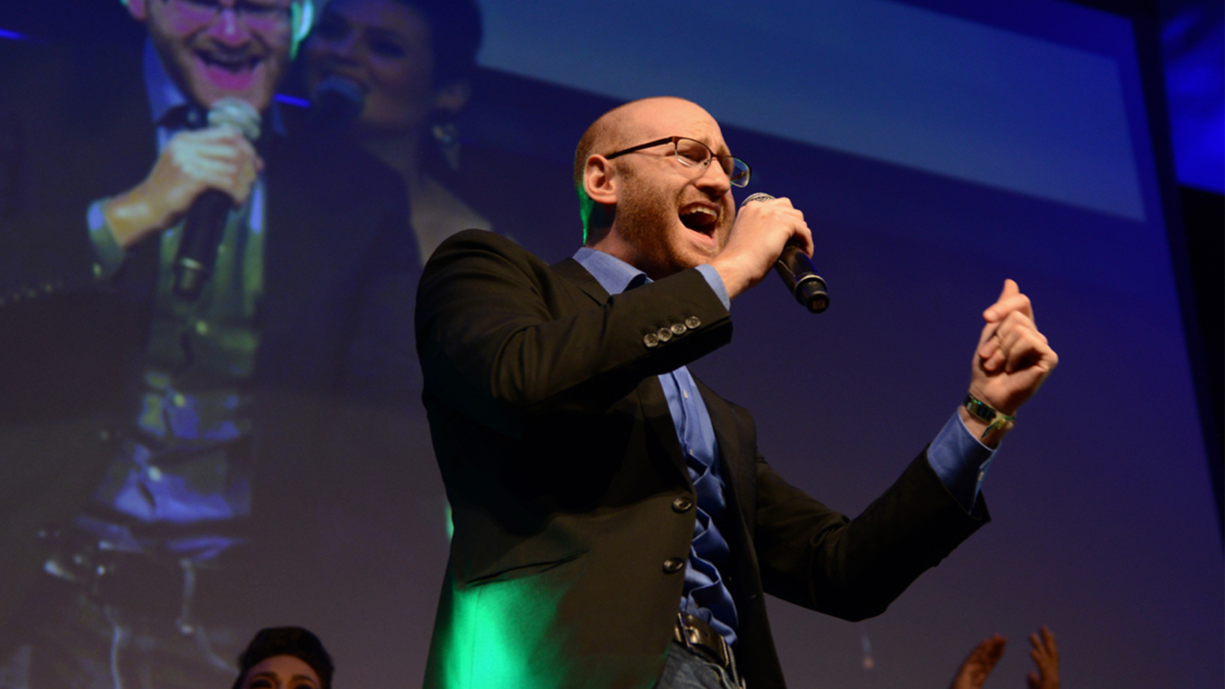 micah composing for peace singing shot landscape centered, lower.png