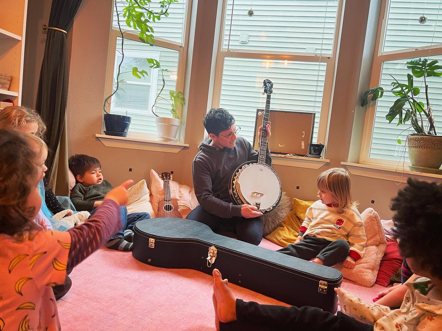 Each morning I play a ukulele at circle time and the children even play it sometimes. Also once a week our music teacher, Heidi, brings her guitar. This week we got to learn about two other types of stringed instruments&mdash; a banjo and a harp! Fun