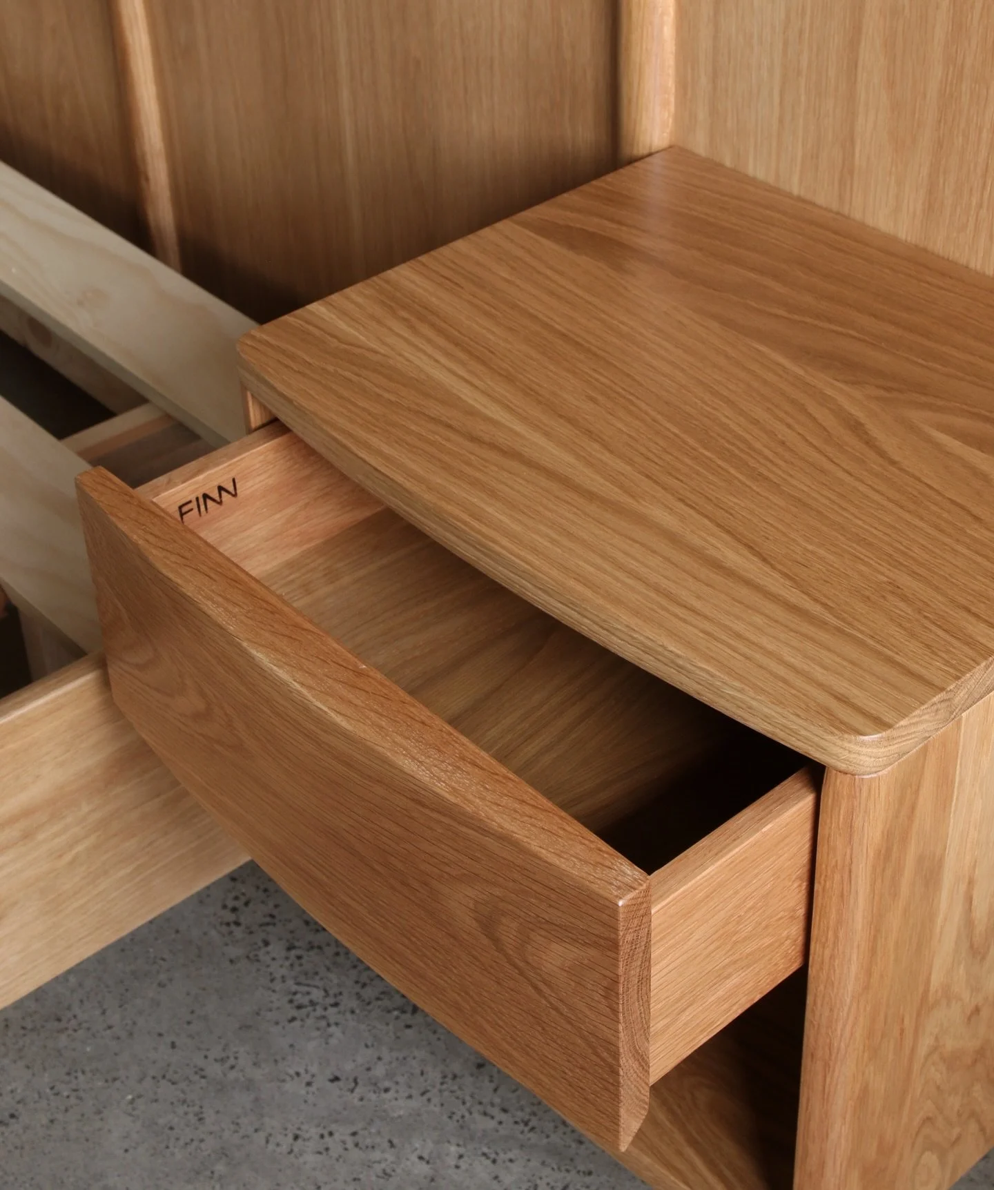 King Bed &amp; Bedsides in Oak.

This bed is designed to be built in, with PowerPoints and light switches incorporated into the bed head. The bed was made in several pieces for ease of transport and access to the upstairs bedroom. 

Made from America