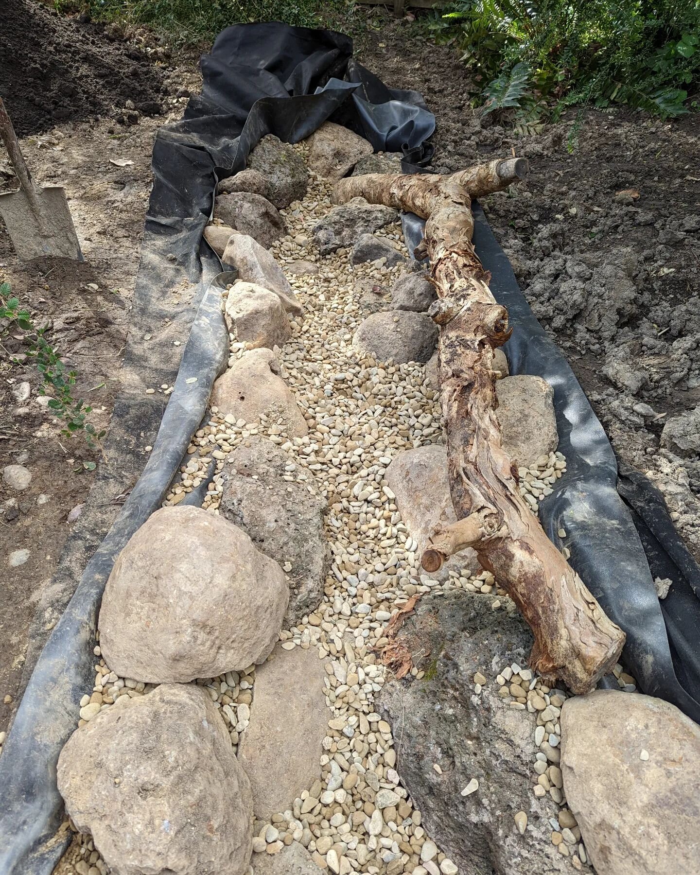 Progress shots are great to show people how our ponds and streams go together! 
We're in #montmorency this week building a neat little water feature, as part of a full backyard makeover, including logs and branches from this property 👍 
Christmas is