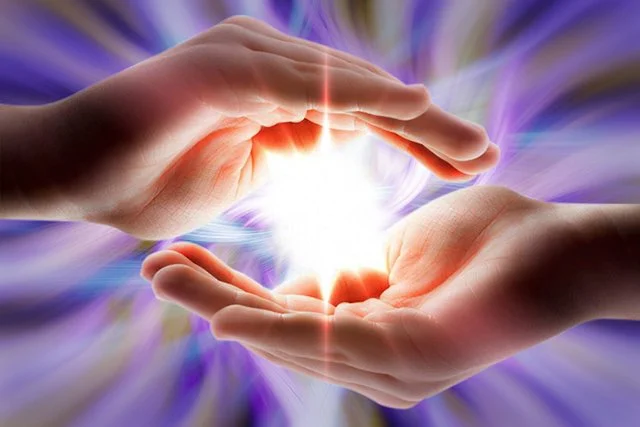 Reiki hands around ball of light 2023.jpg
