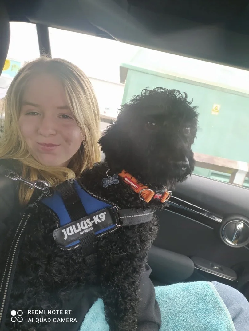 Jasmine with a dog on her lap