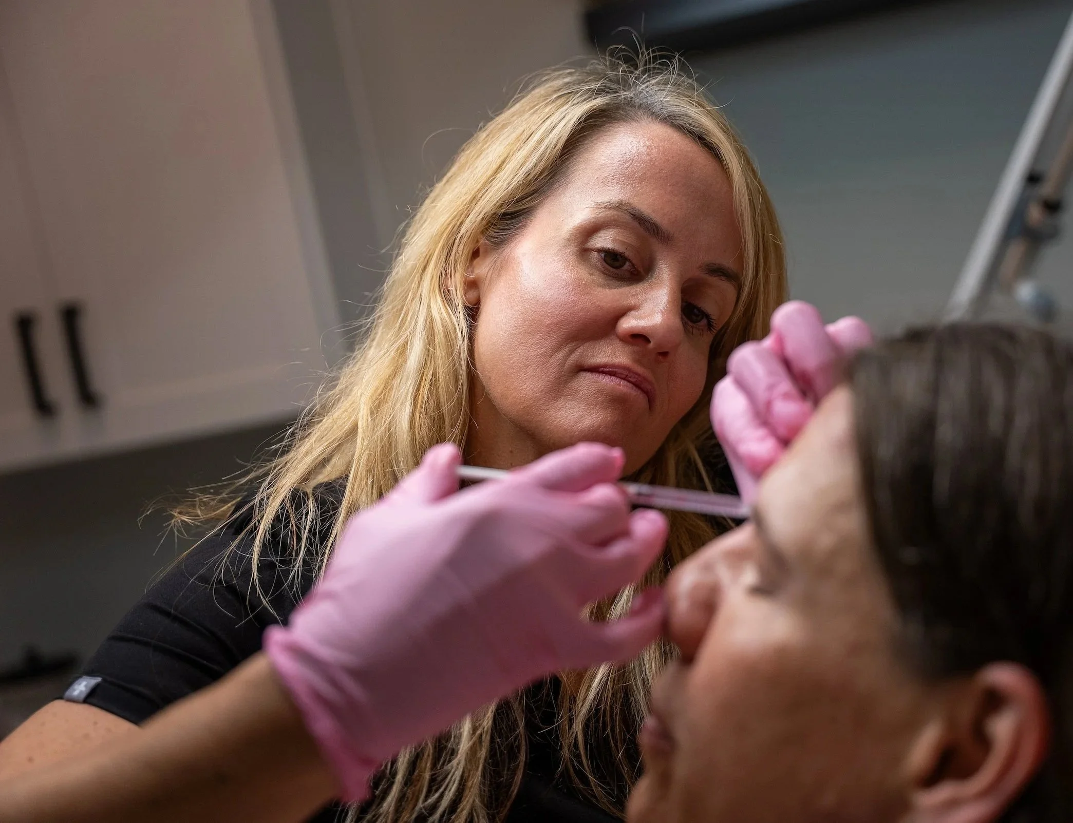 Image of a woman receiving botox.