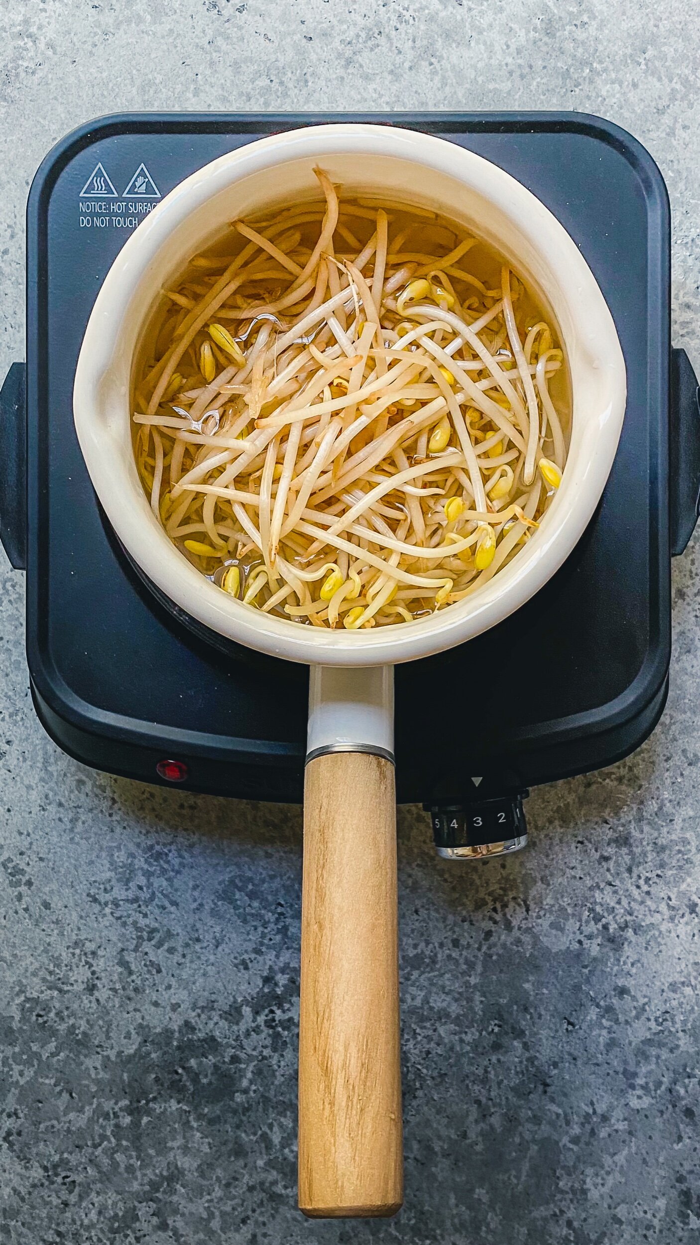 Cover  and cook 1 lbs bean sprout for 4 mins. Rinse in cold water and drain.