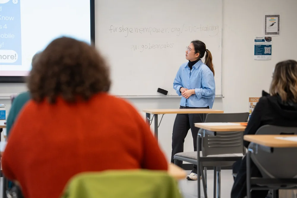 A First Gen Empower workshop facilitator presenting to students