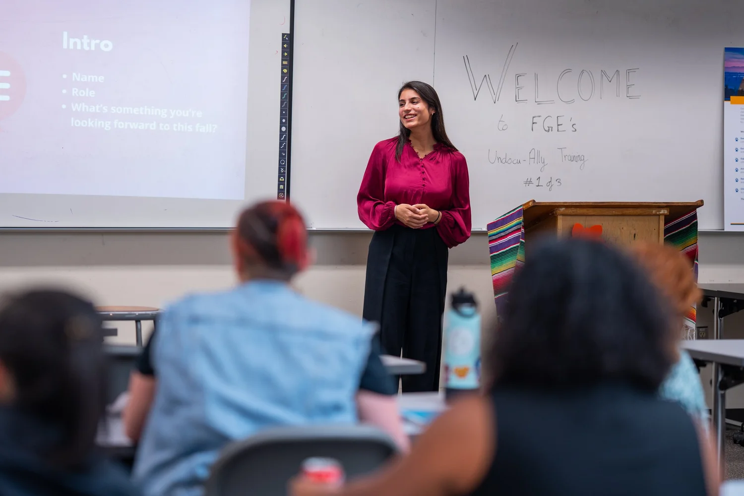 A First Gen Empower facilitator presenting to a room of educators
