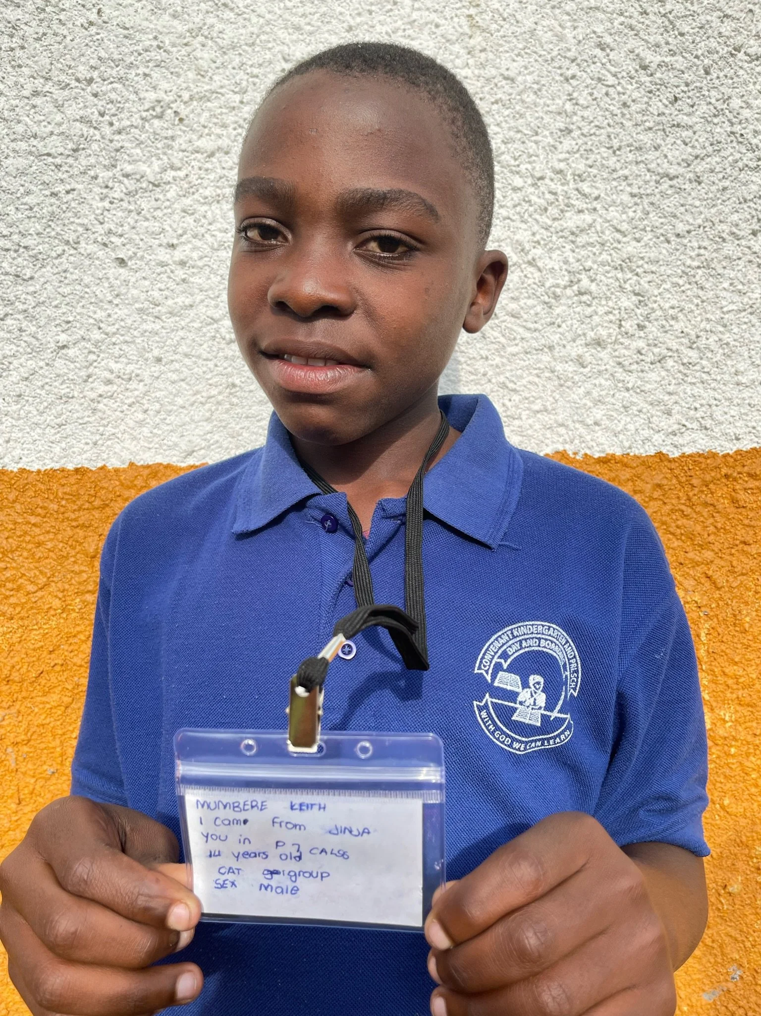 Mumbere Keith, age 14