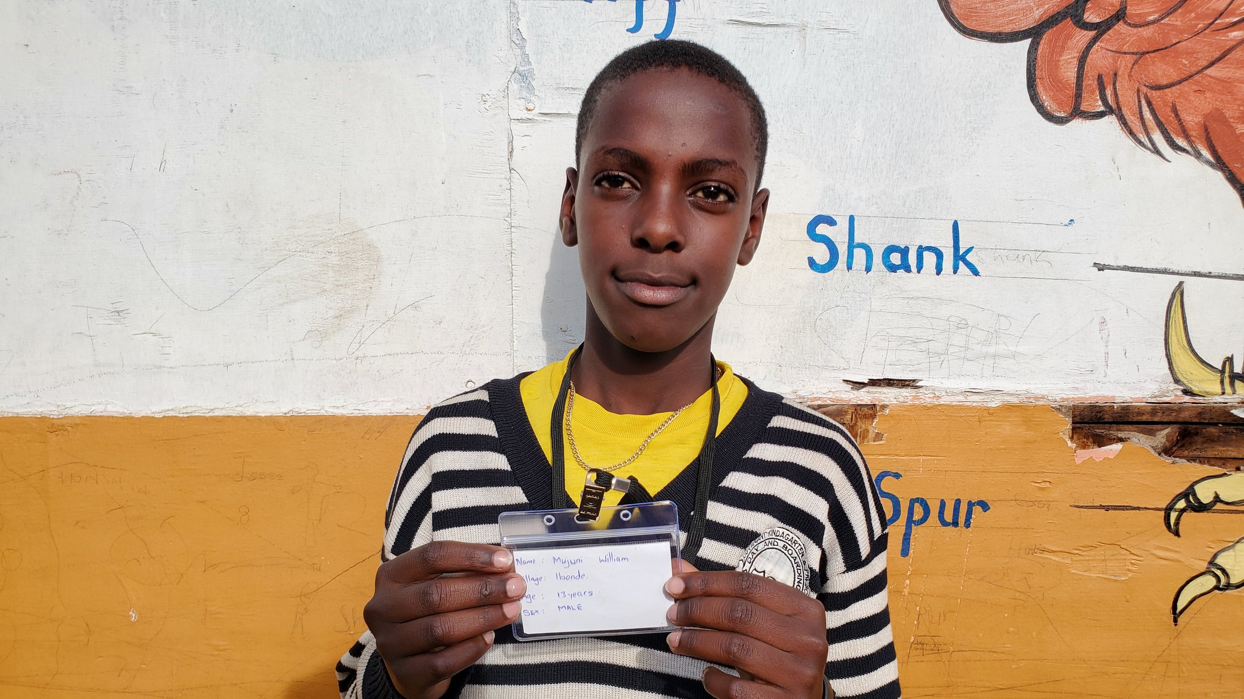 Mujuni William, age 13