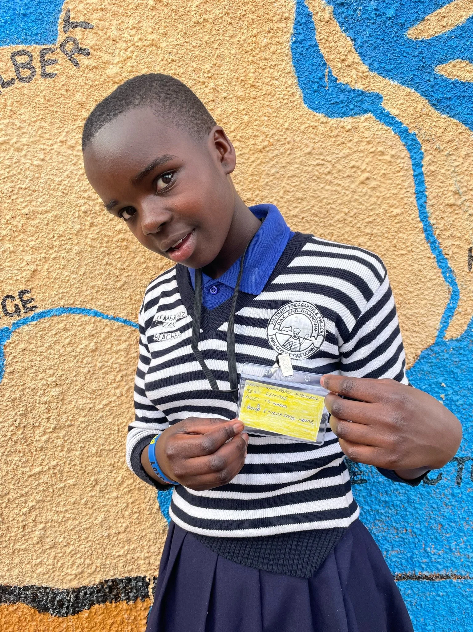 Kembabazi Racheal, age 13