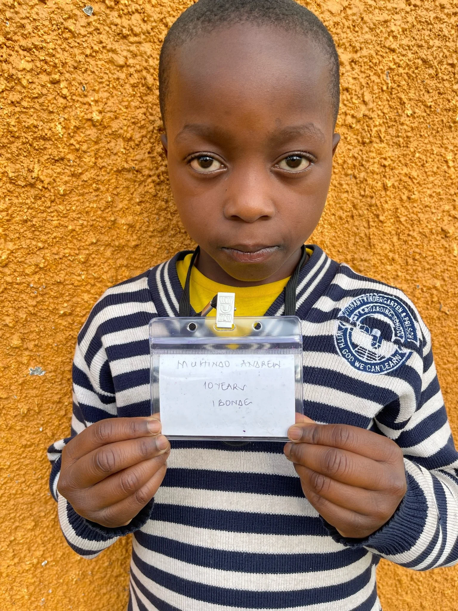 Muhindo Andrew, age 10