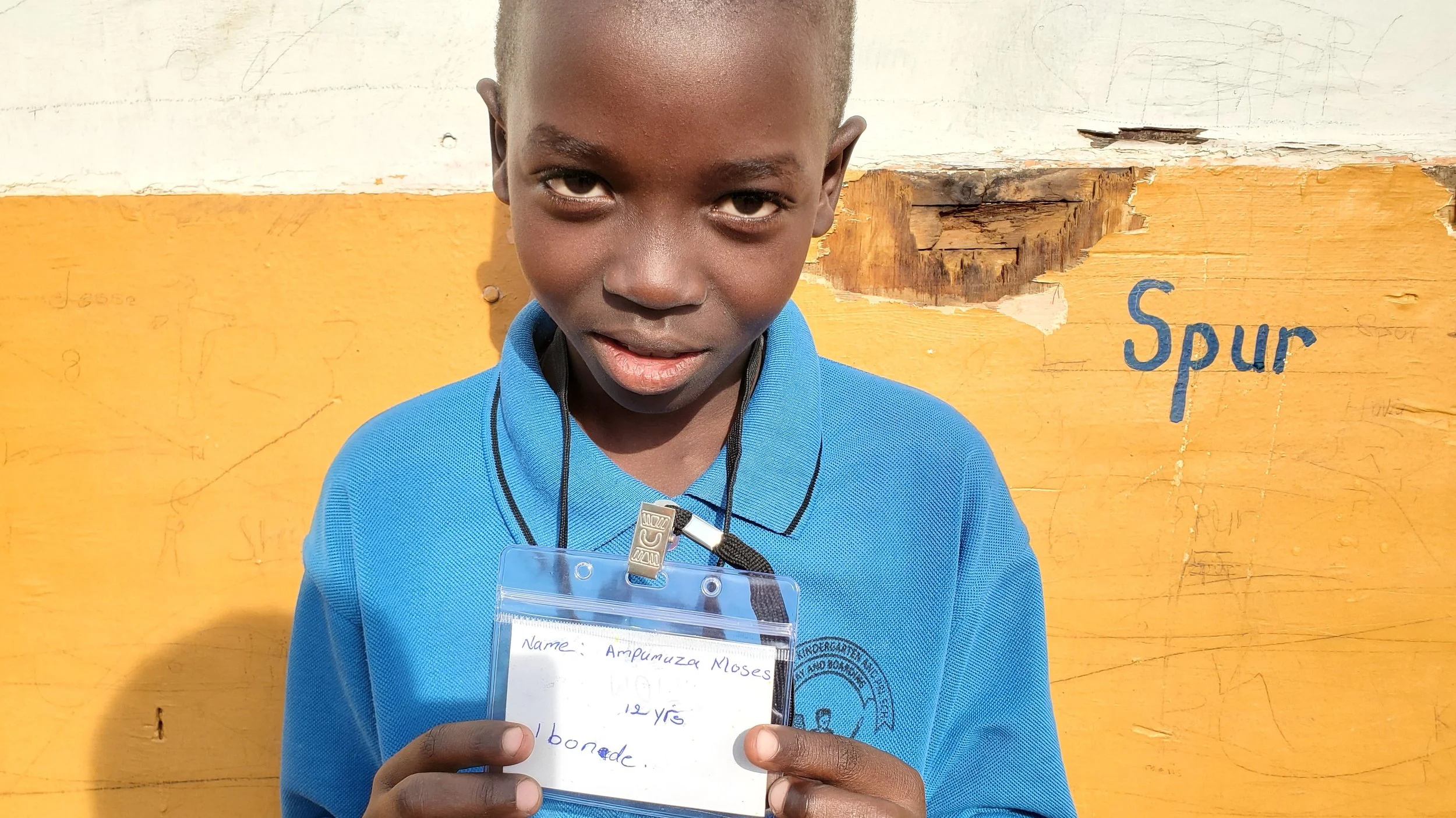 Ampumuza Moses, age 12