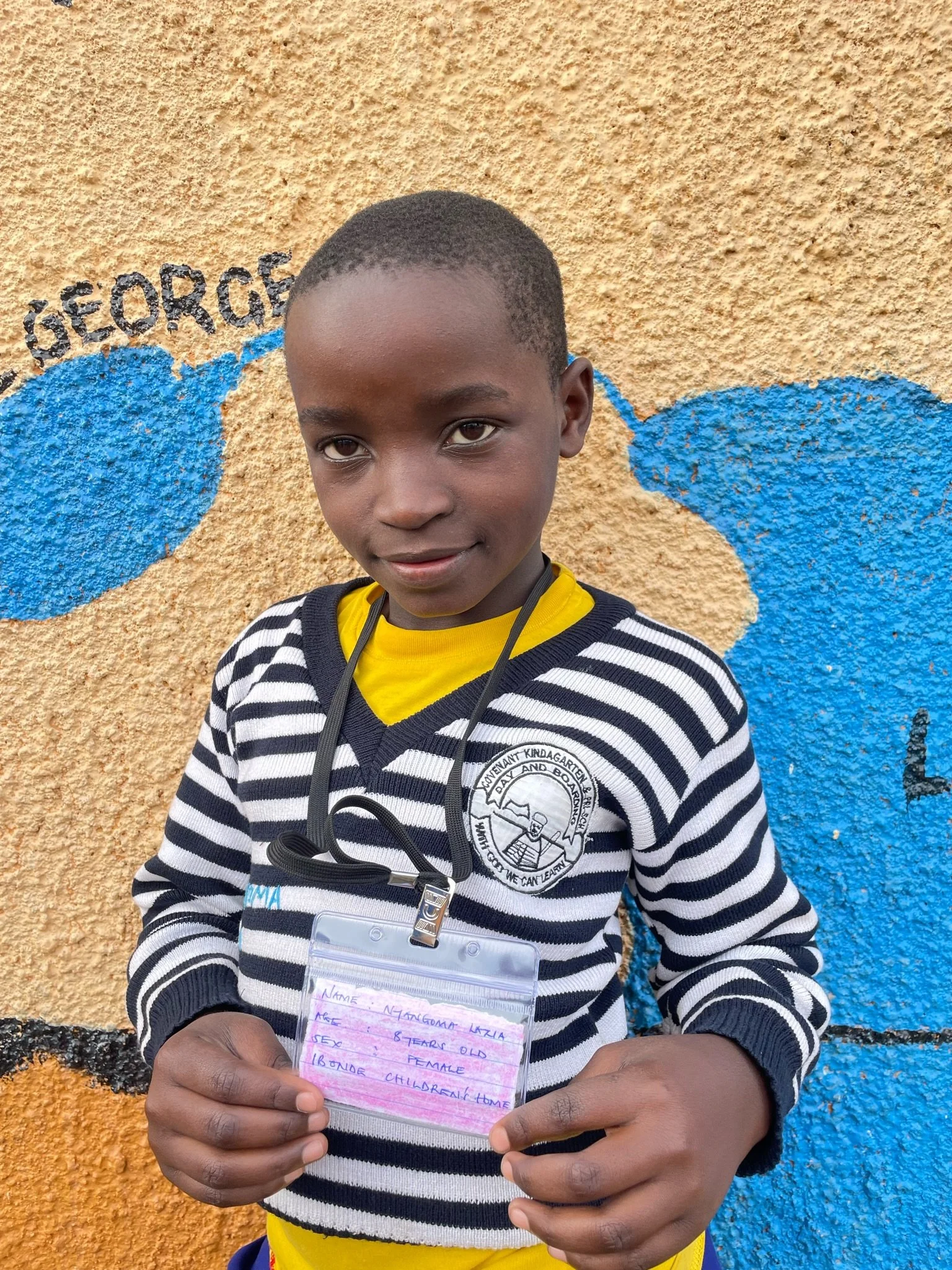 Nyangoma Lazia, age 8