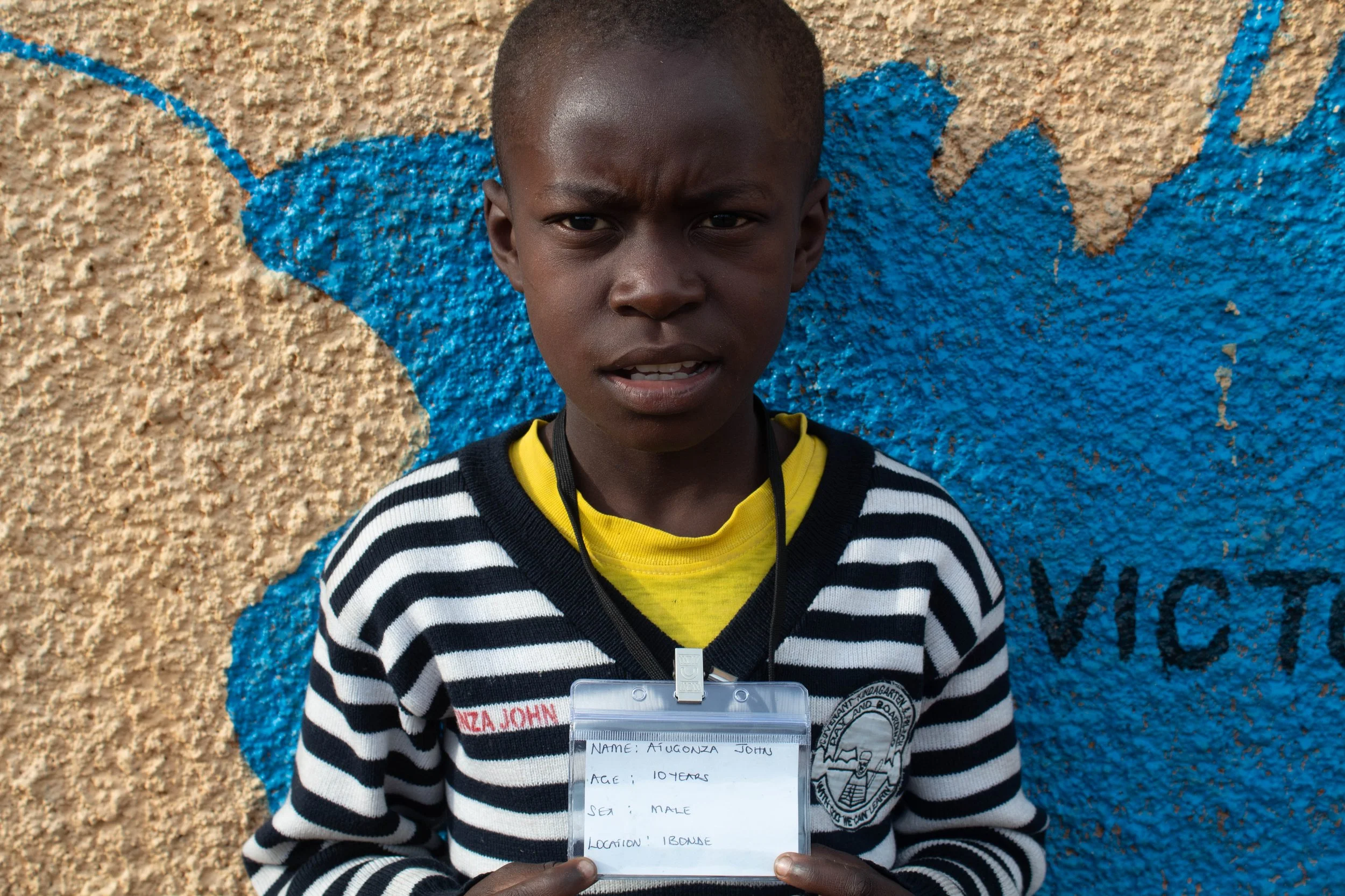 Atugonza John, age 10