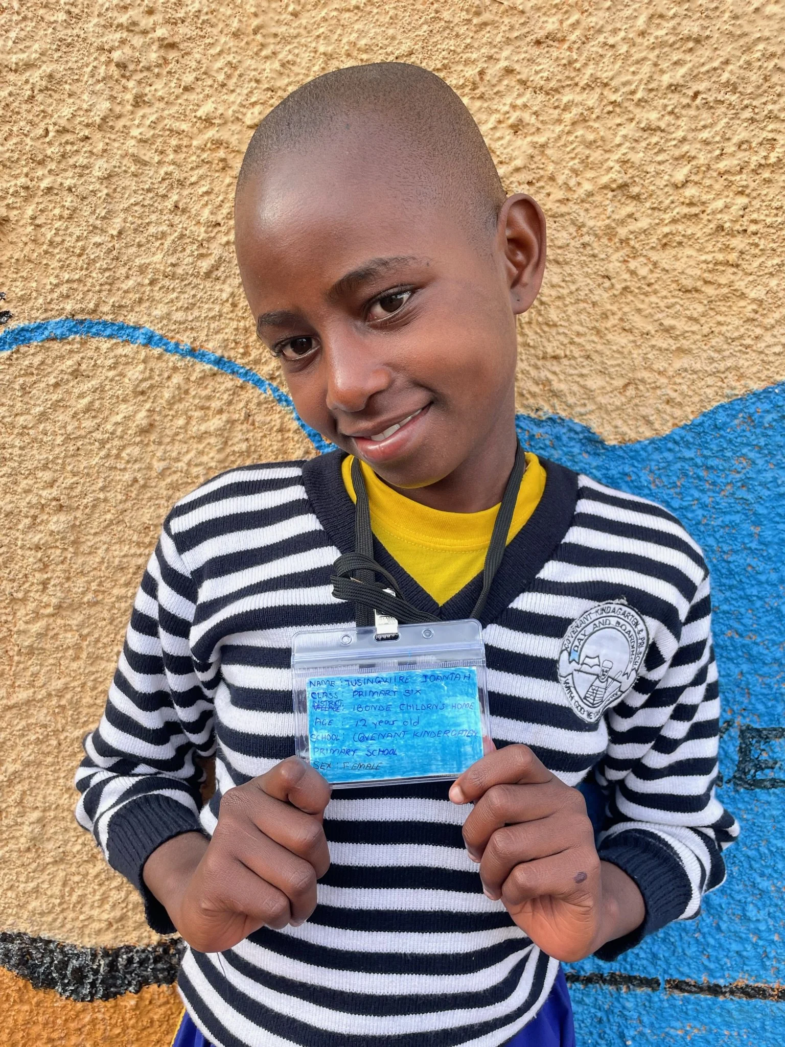 Tusinguiire Joantah, age 12