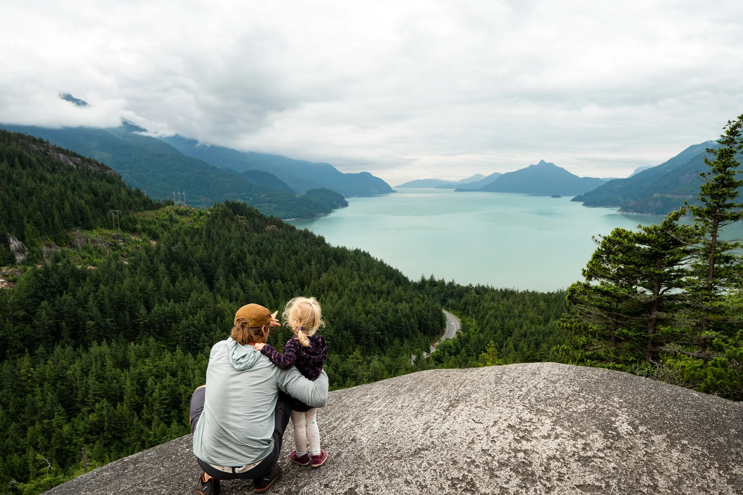 Father and toddler hiking in nature