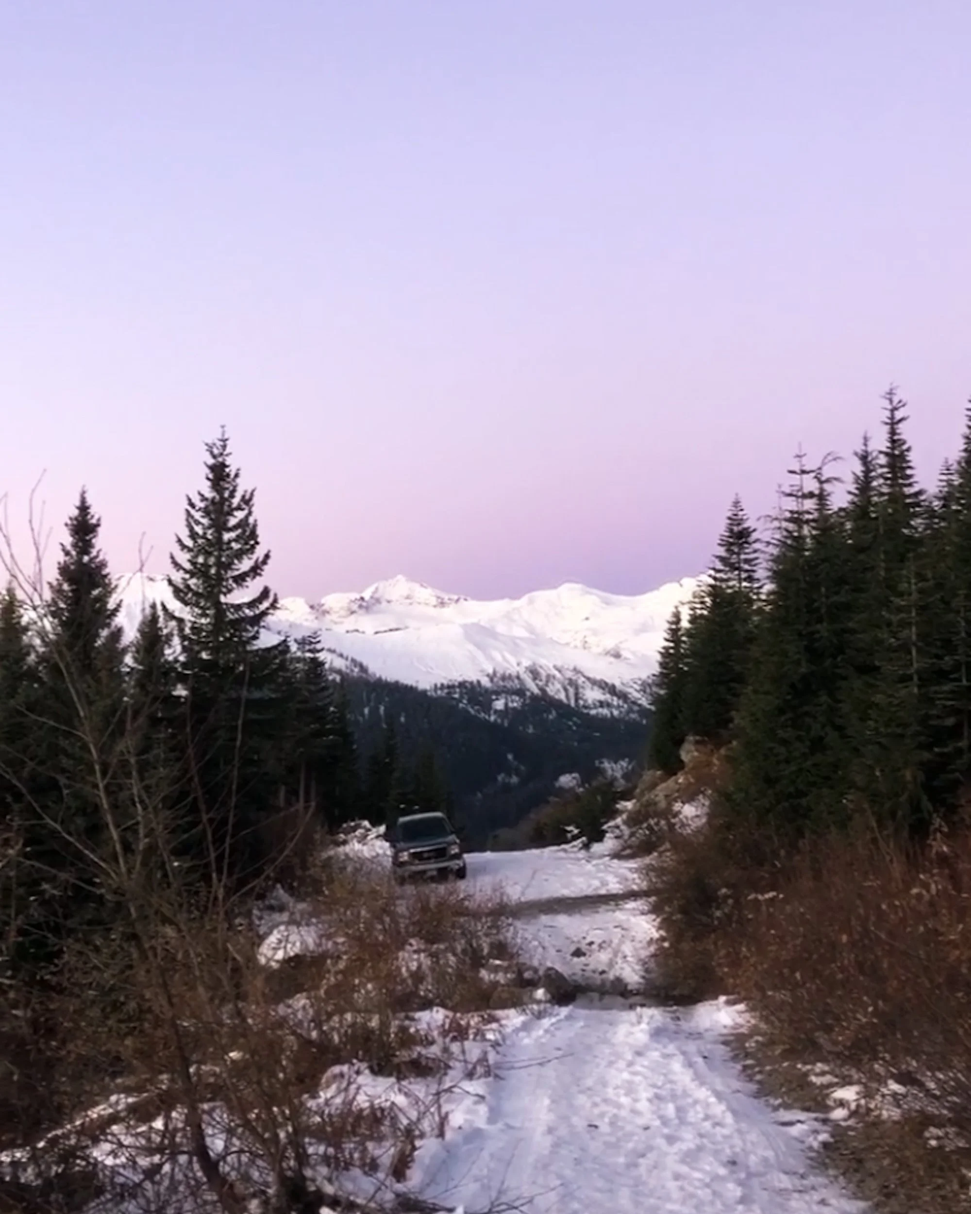 4WD at a trailhead in the pink light of winter morning