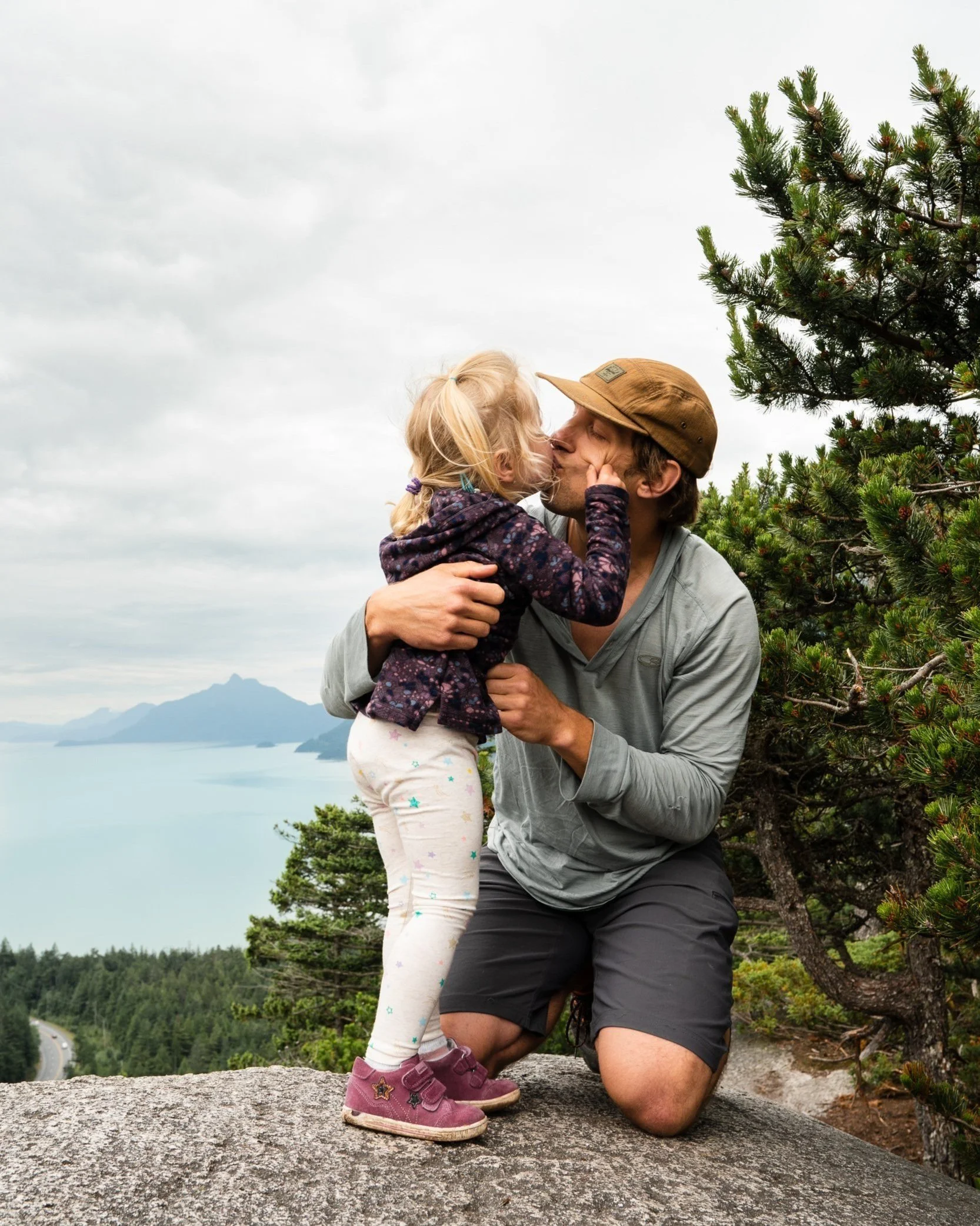Father and toddler hiking in nature