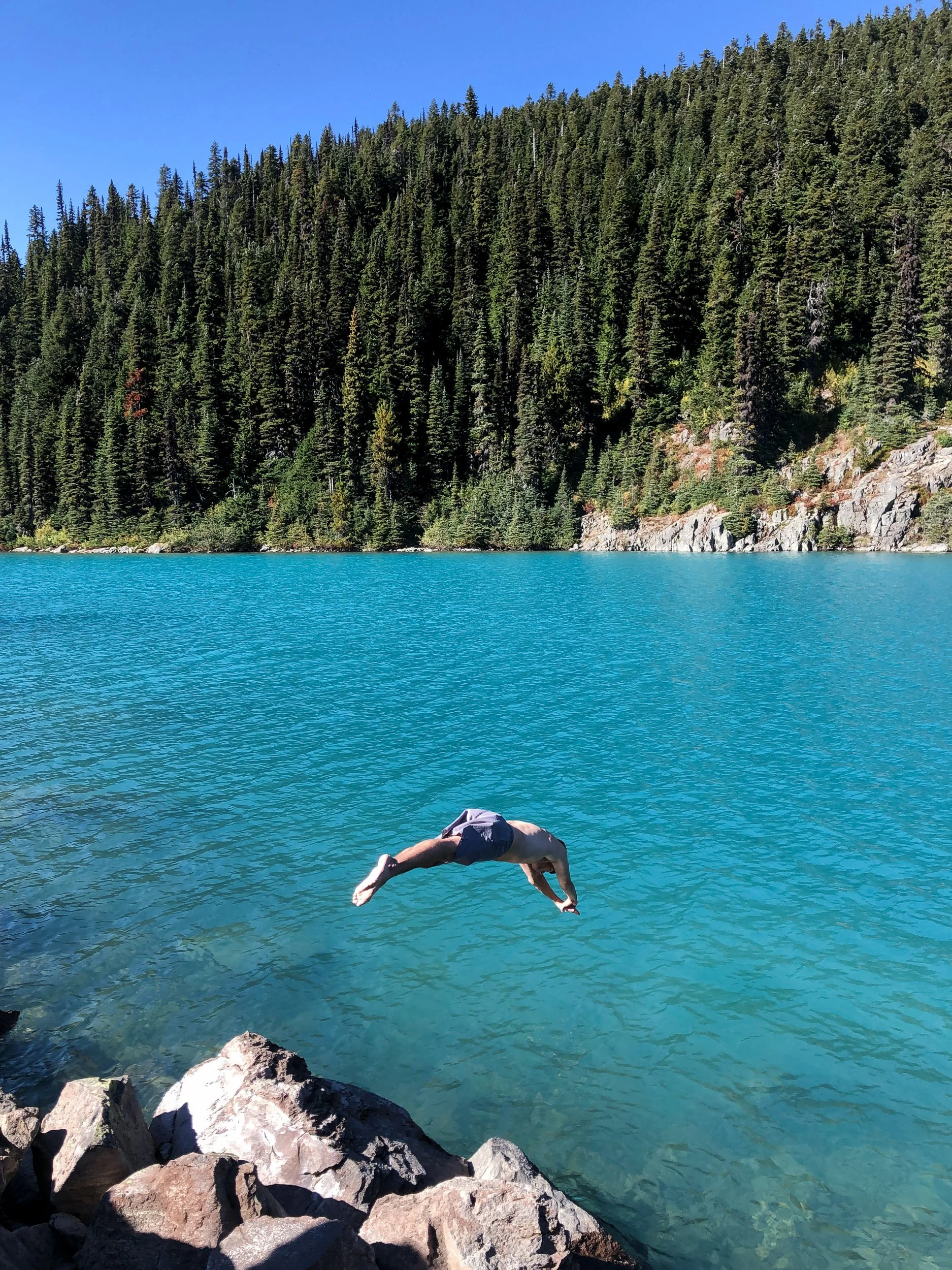 Plunging into turqoise lake in British Columbia, Canada