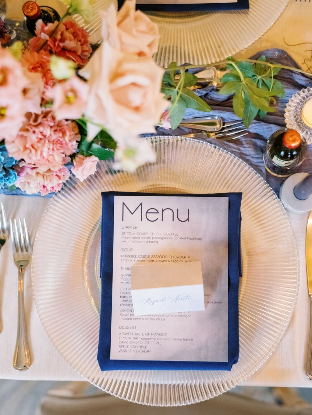 Markree Castle wedding menu and place setting with blue napkin blush florals and gold charger plate Sligo Ireland