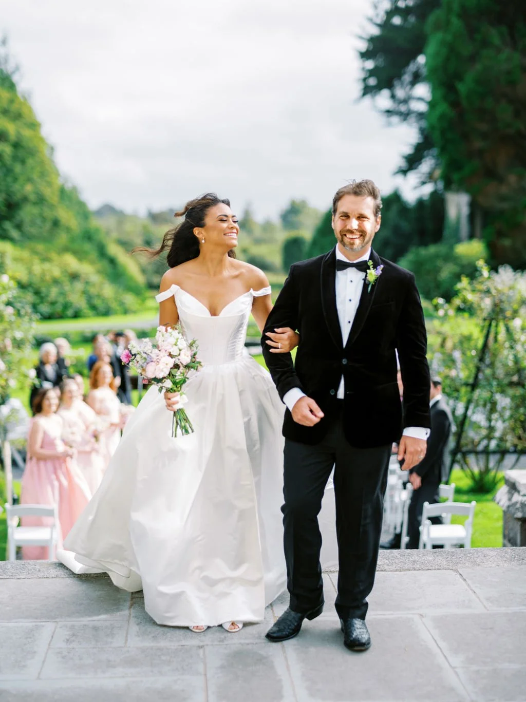 Bride and groom just married walking through Markree Castle gardens Sligo Ireland destination wedding
