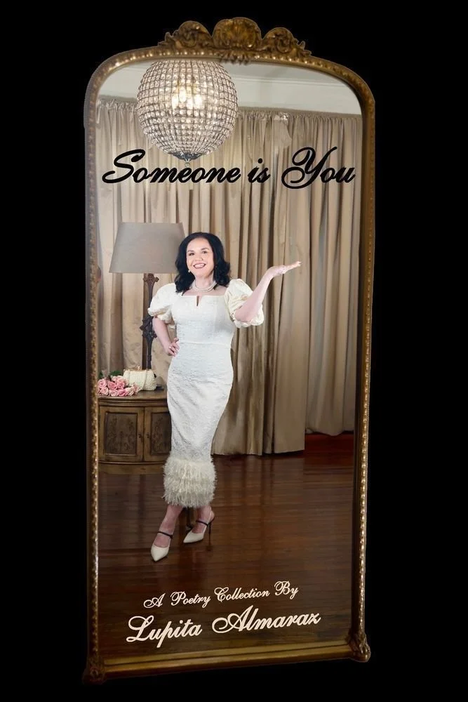 A woman in a white dress standing in front of a mirror with curtains behind her, a chandelier above, and a lamp on a side table. The mirror has the text 'Someone is You' and 'A Poetry Collection By Lupita Almaraz' written on it.