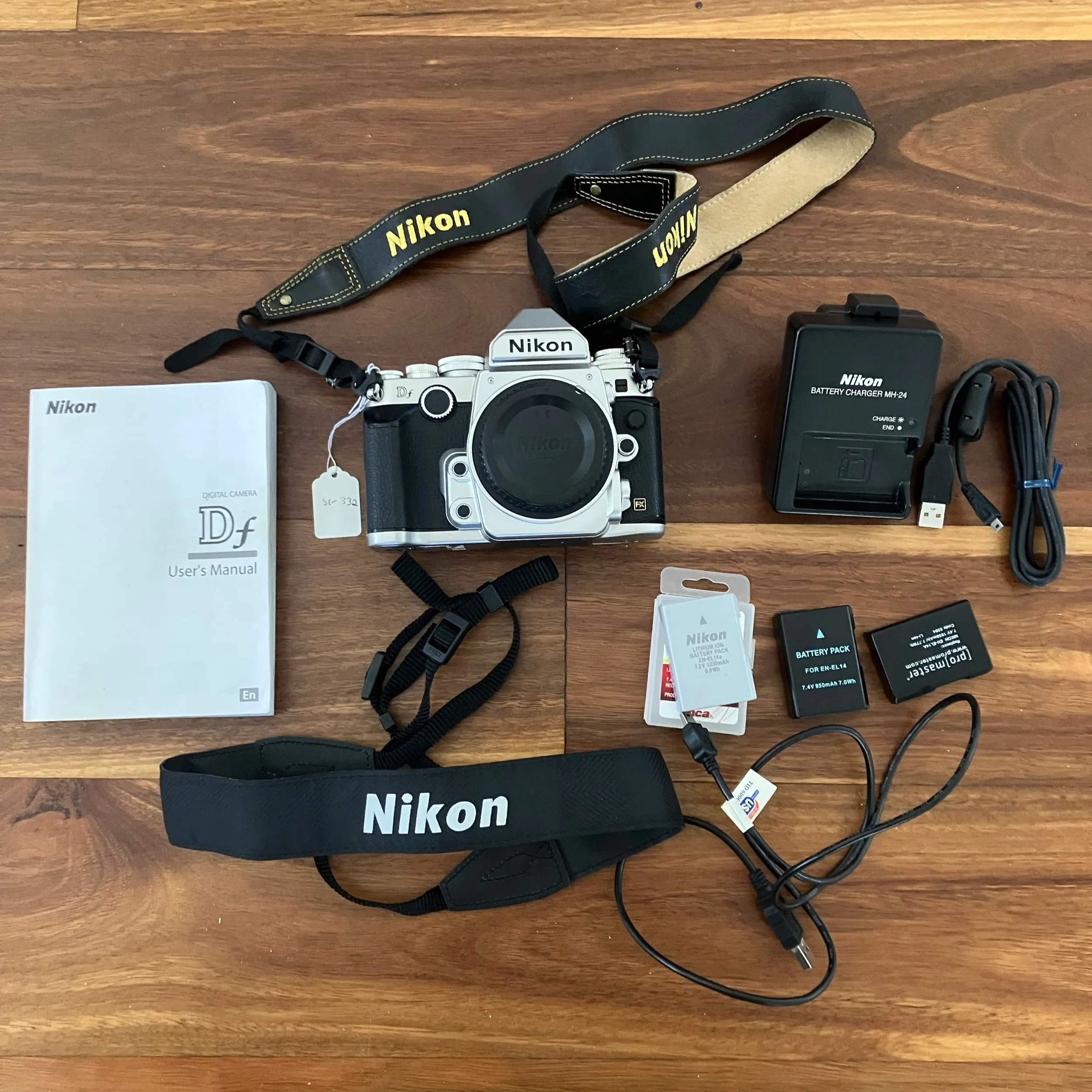 Nikon Df with batteries, straps, charger and manual.