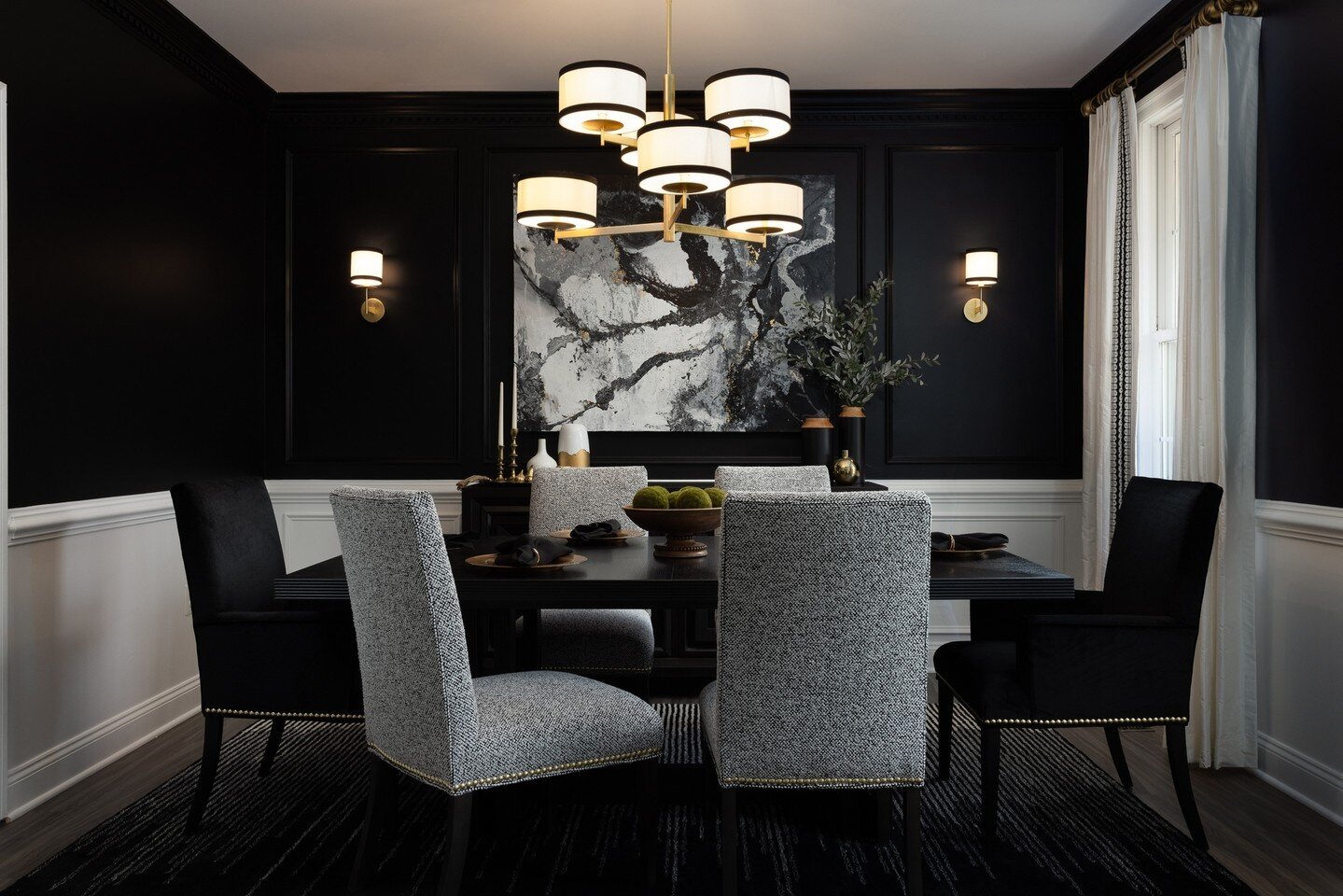 Check out the mood! So much drama in this dining room! Black walls and velvet chairs create a luxe experience.⁠
⁠
Photographer: @christykosnicphotography⁠
Designer: @2navylaneinteriors⁠
⁠
#diningroomdesign #abstractart