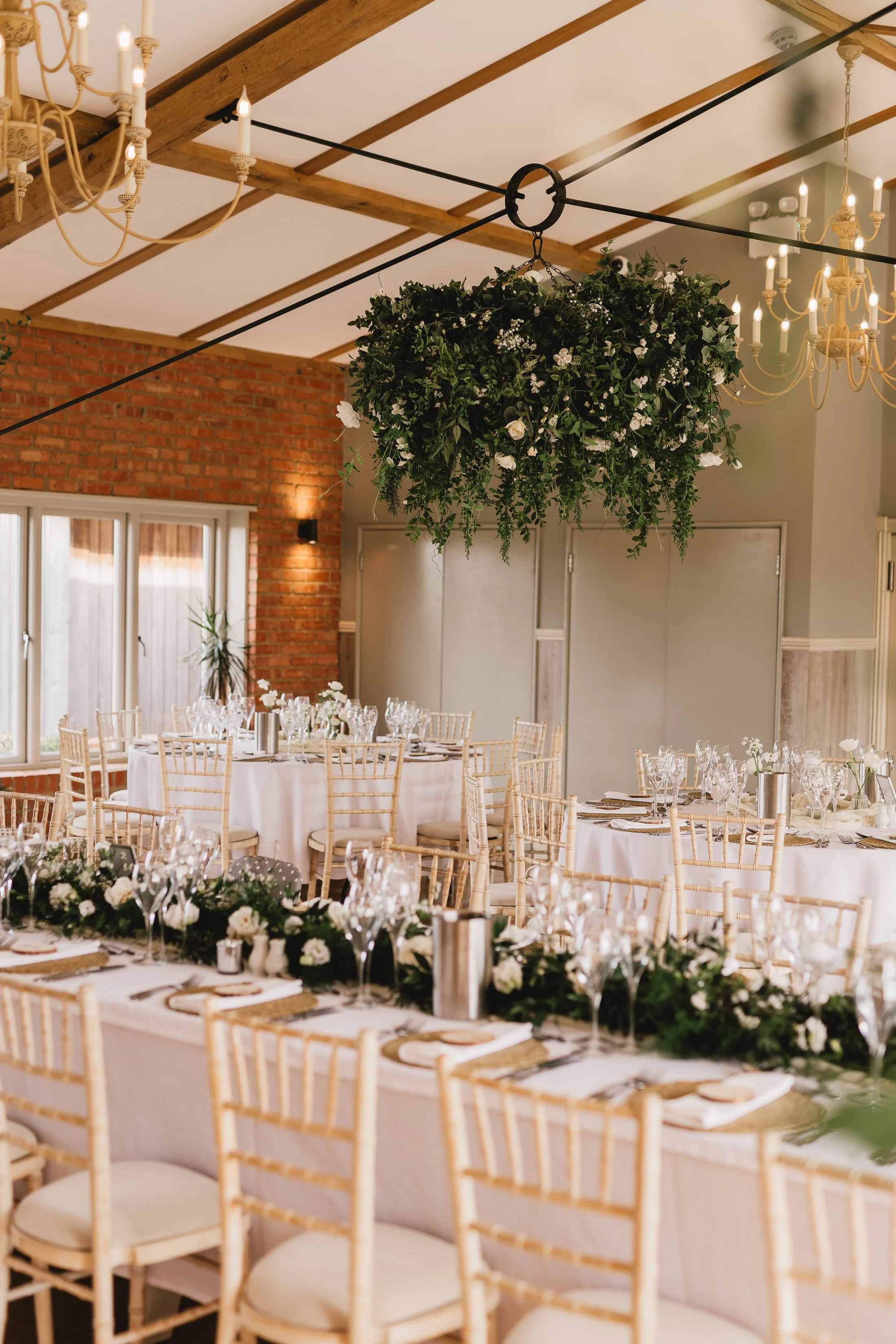 hanging floral halo with greenery and white flowers at Cider mill barns