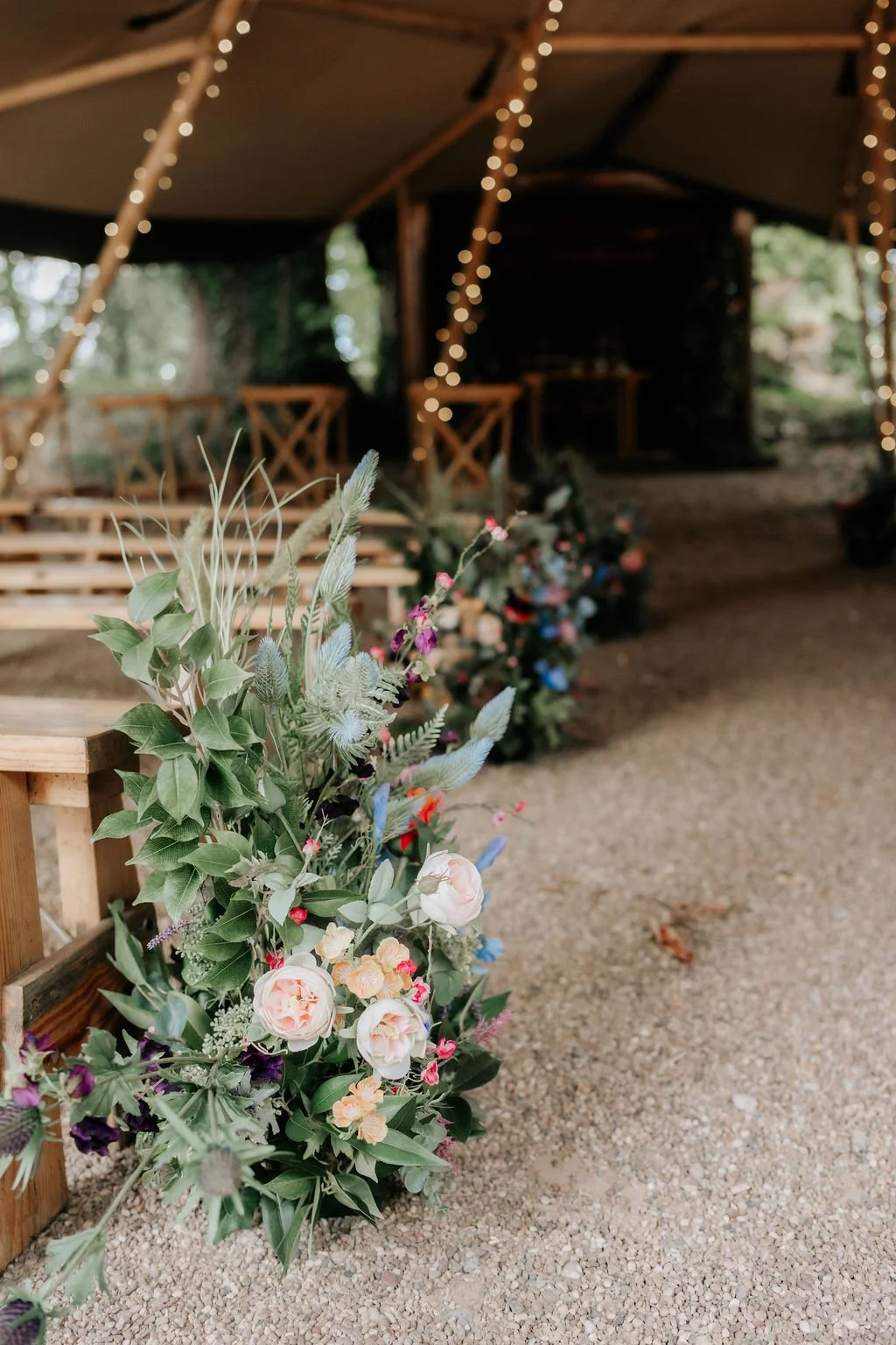 Discover artificial wedding flower hire for Tipis at Whatton House in Leicestershire. Explore our venue package, with ceremony flowers and table styling.