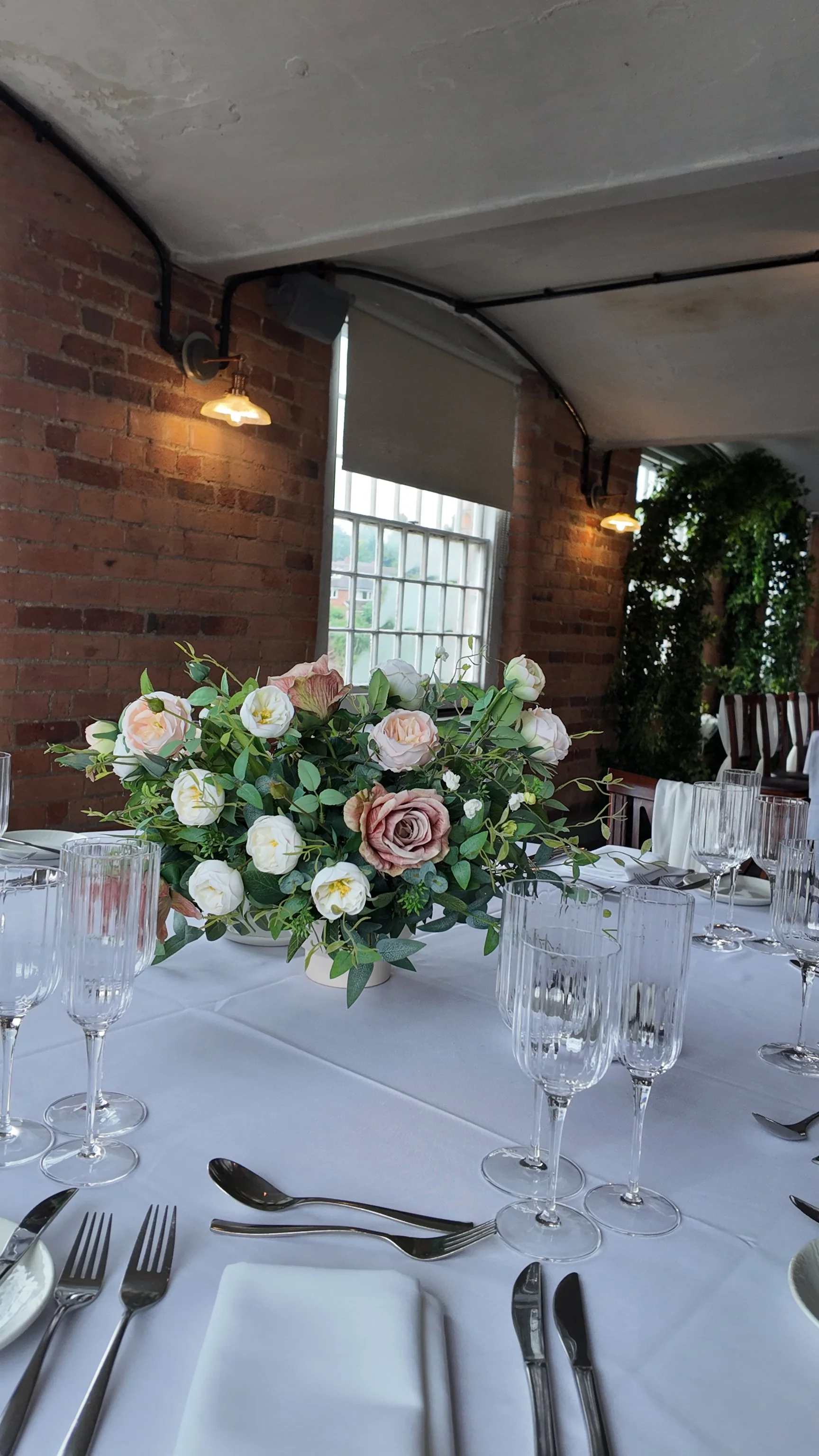 Blush pink rose and foliage artificial wedding table centrepiece