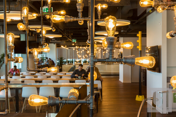 Professional commercial photography of the eating area at Shopify's Ottawa offices