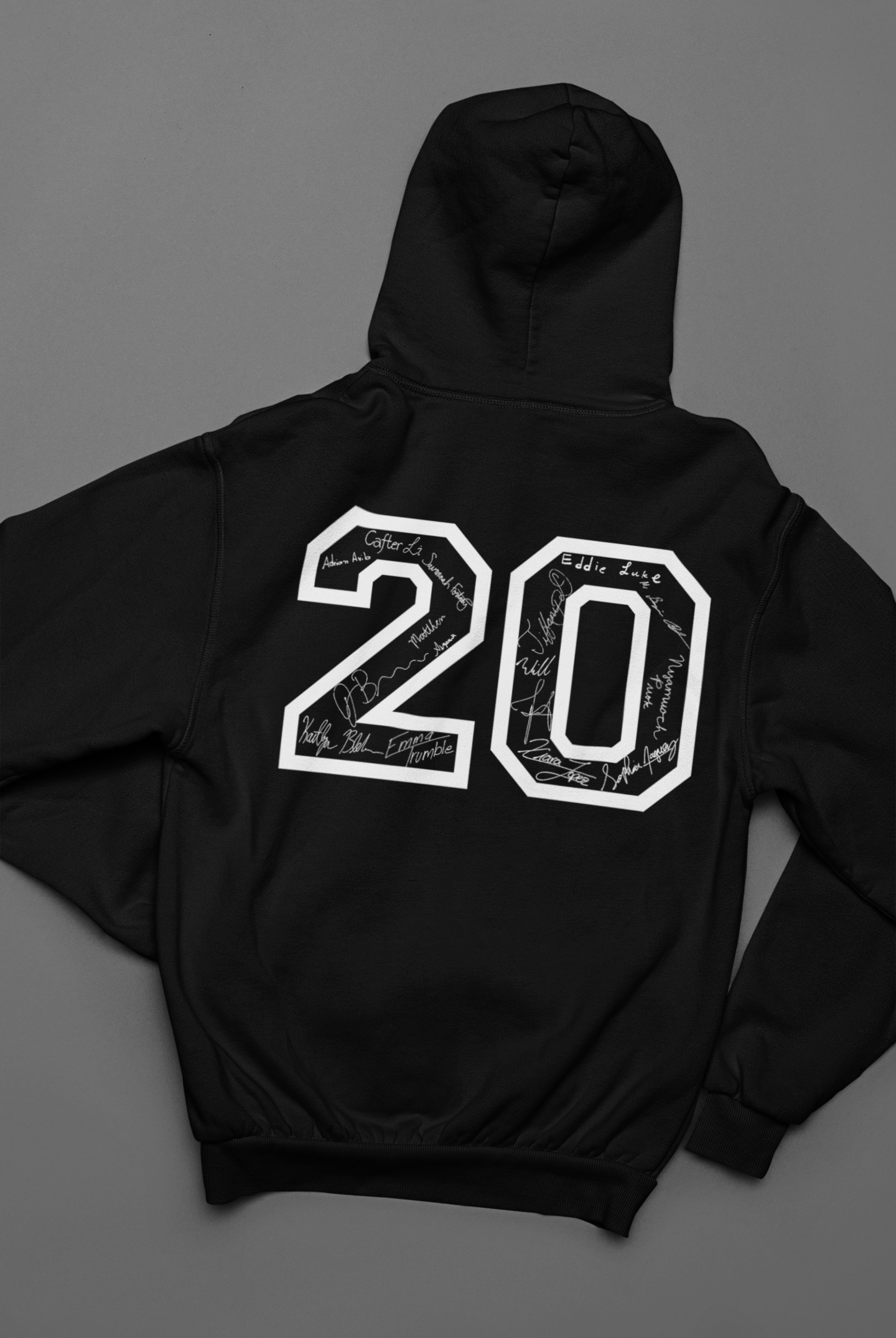 back-view-mockup-of-a-hoodie-lying-over-a-solid-surface-33900.png