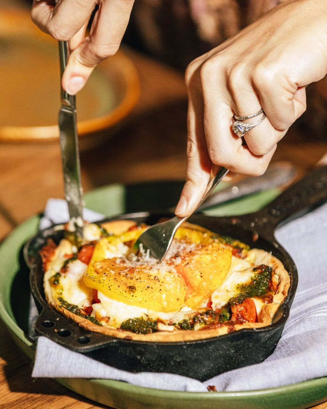 You can&rsquo;t talk about Lenoir without mentioning *her*. The Roasted Tomato Pie &mdash; layers of roasted tomatoes, sweet onion, mayo, basil, thyme, fontina, and mozzarella. Comforting, melty, and absolutely iconic.

Plus, she'll be making a speci