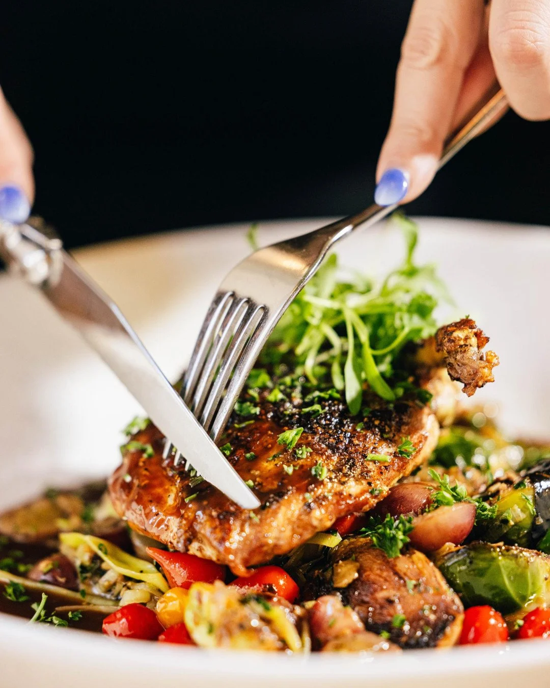 Keeping it cozy and classic this weekend with our @JoyceFarms pan-roasted chicken breast &mdash; grape-roasted Brussels sprouts, leeks, sweet pepper drops, and port chicken jus. A dish that proves simple comforts never go out of style. Perfect for sl