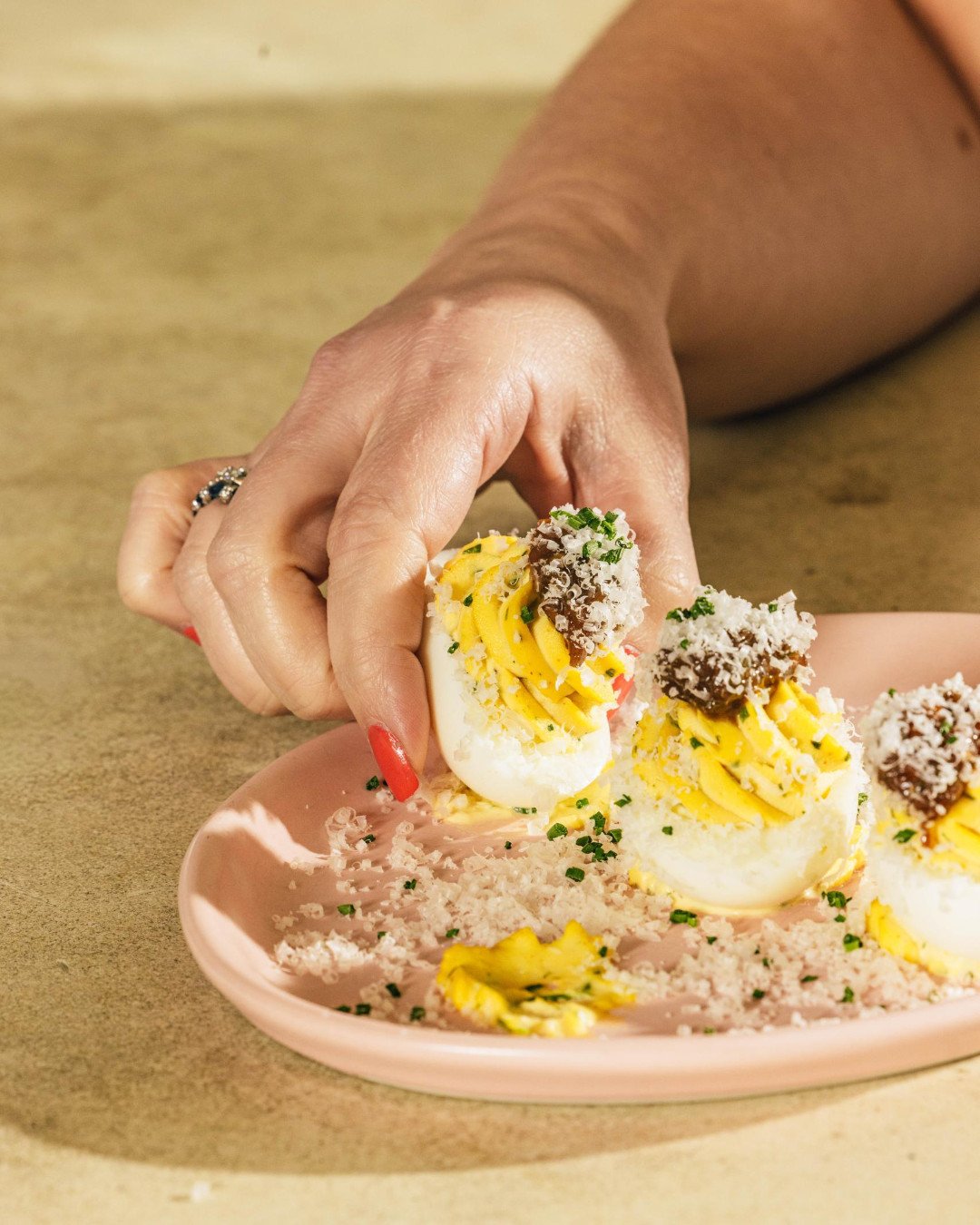 Silky smooth deviled egg with bacon, jalape&ntilde;o jam, and pecorino. You know you want one (or three).