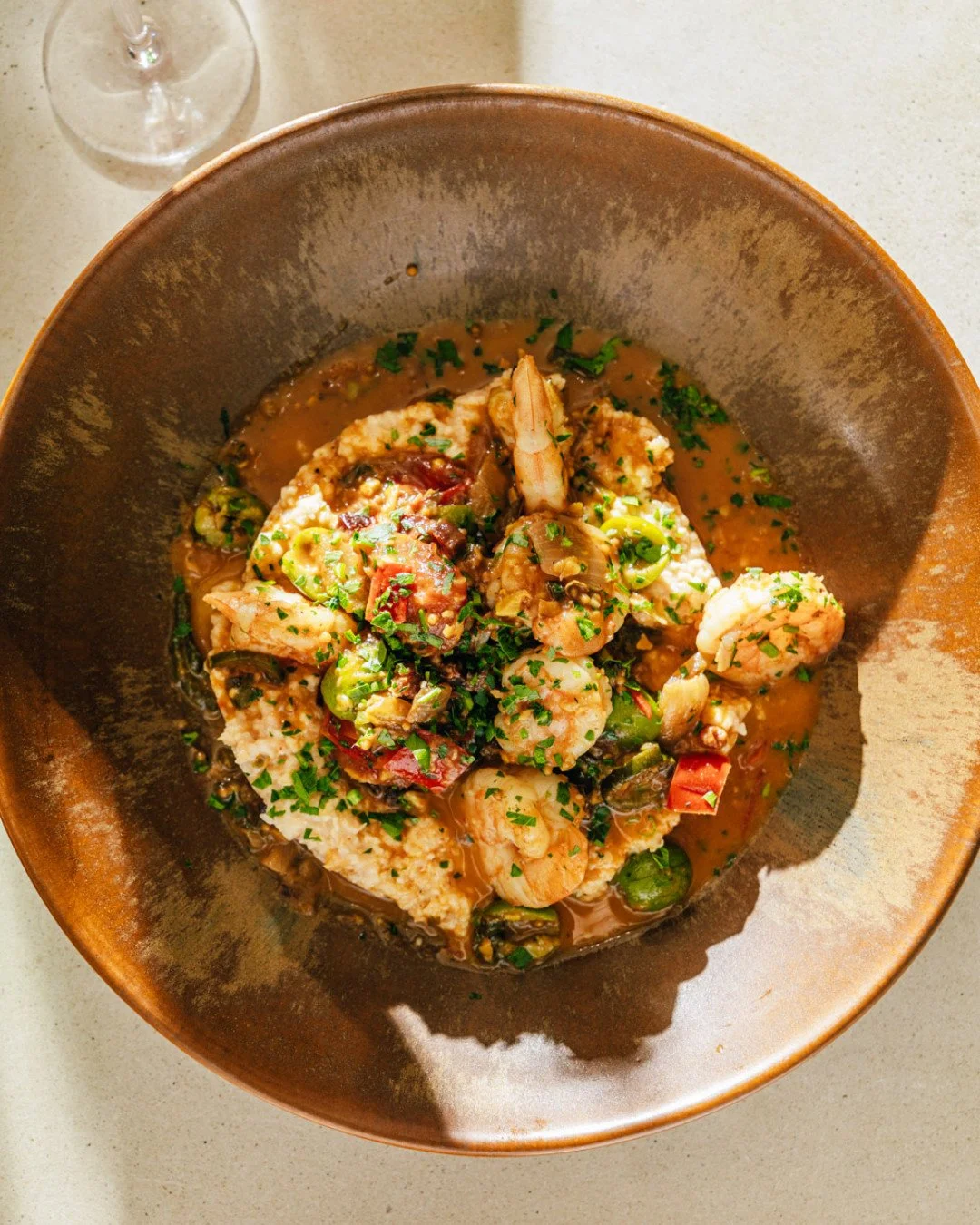 Shrimp and grits is kinda like Charleston's love language 🦐 Ours comes with pimiento cheese grits, crispy pork belly, Castelvetrano olives, and a spicy tomato butter. We show our love every weekend at brunch. 

Reserve on @resy.